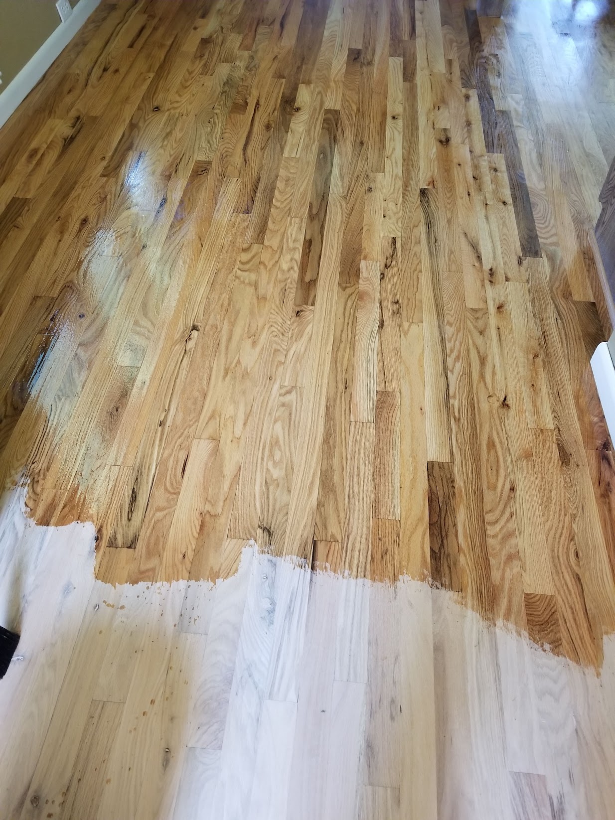 Finished hardwood flooring installed by Envision Builders in the Illinois Valley