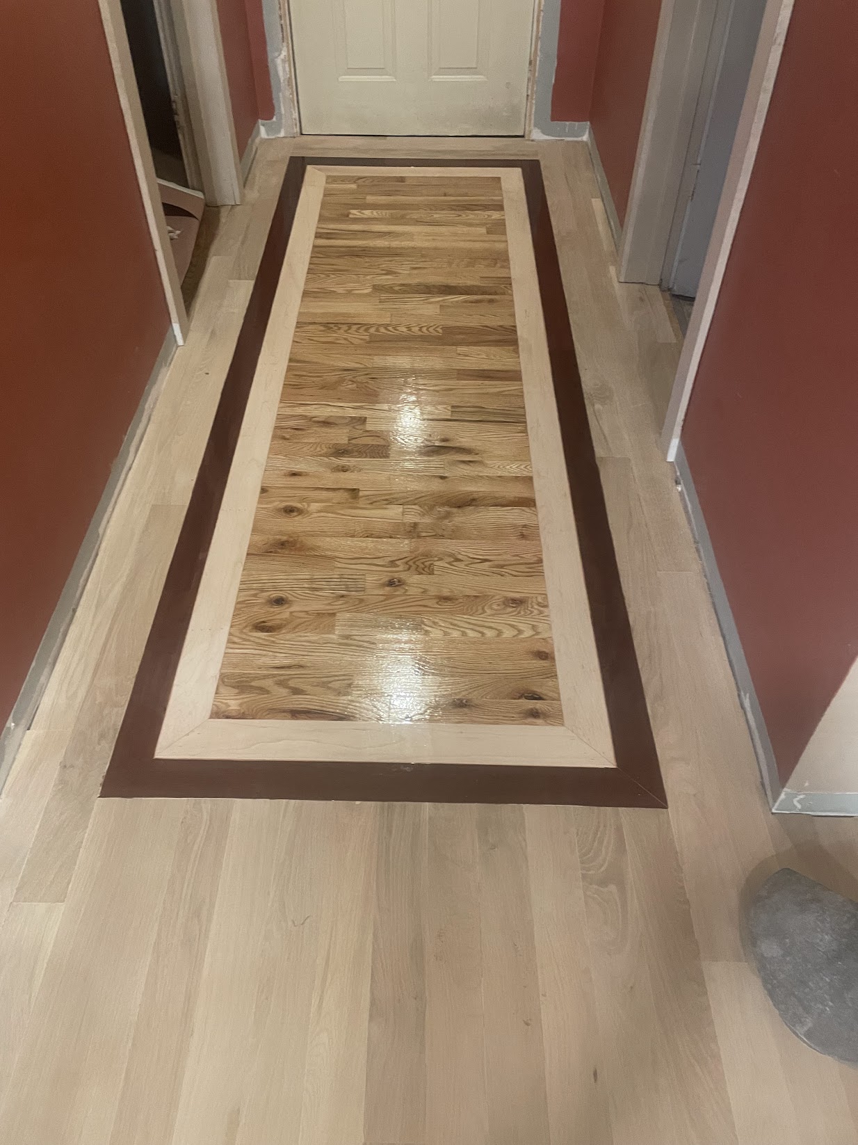 Finished specialty hardwood flooring installed by Envision Builders in the Illinois Valley