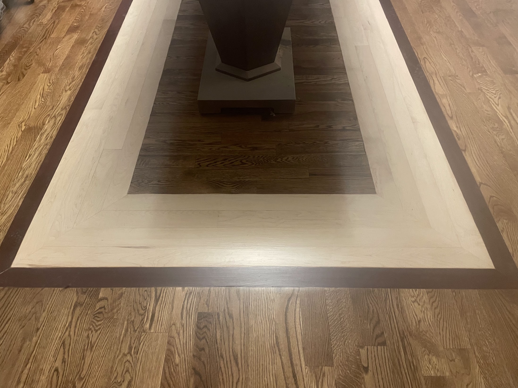 Finished specialty hardwood flooring installed by Envision Builders in the Illinois Valley