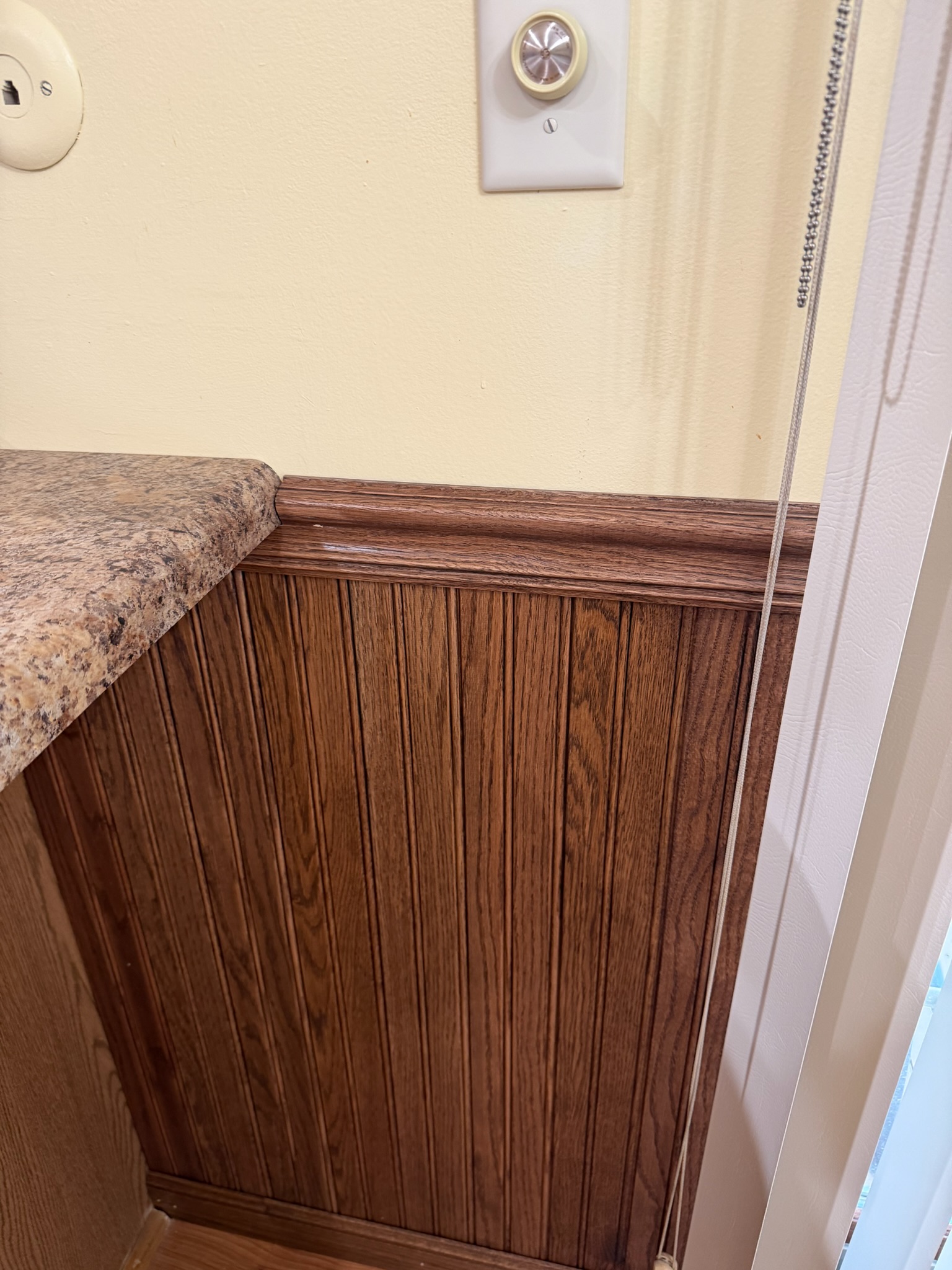 Completed wainscoting installation by Envision Builders in the Illinois Valley