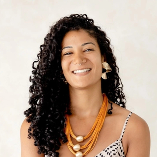 Photo of Jessica L. G., a social entrepreneur, providing a testimonial about working with Rushdi for her career positioning.