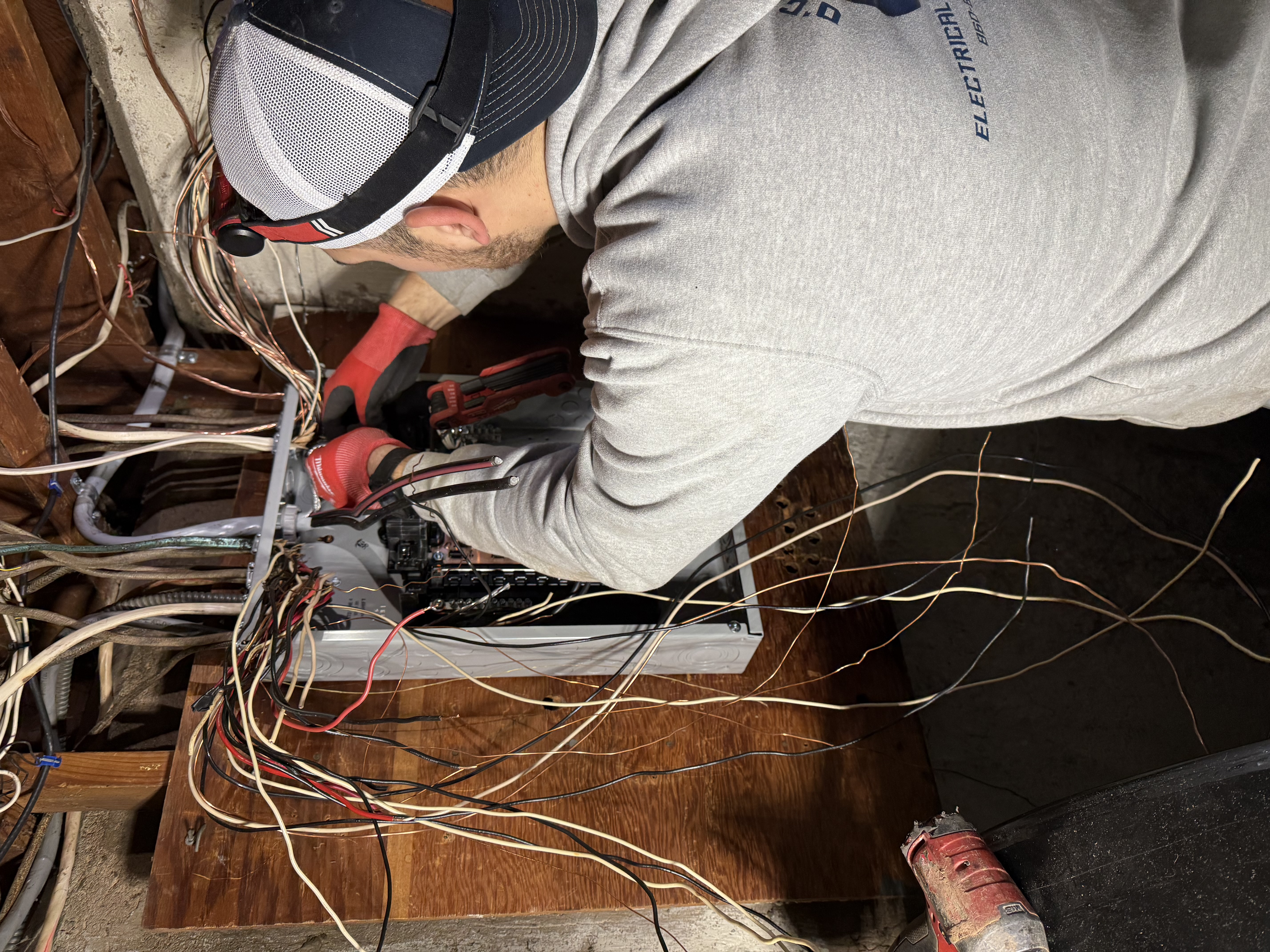 Electrician installing wiring in a residential home