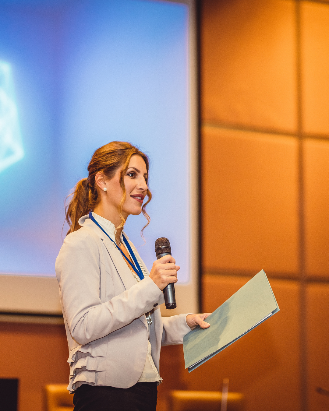 Speaker presenting at a professional event