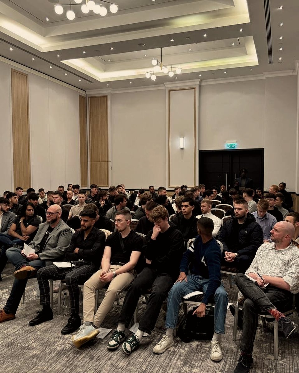 Attendees seated in rows at a prior New Money event