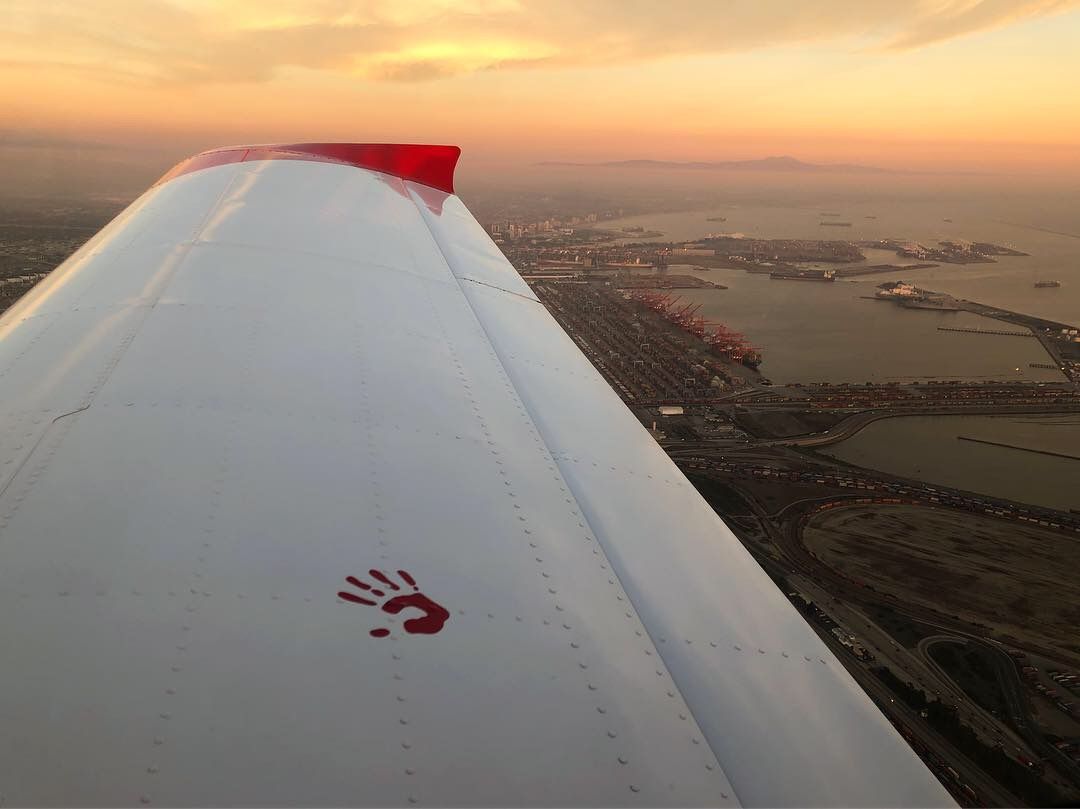 Wing view over the harbor at sunset