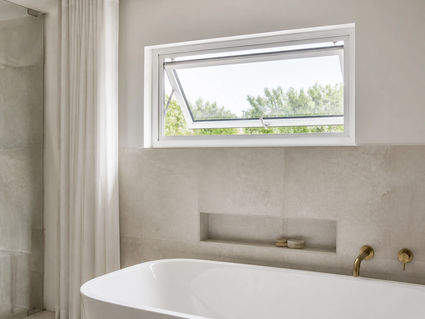 Modern bathroom with a top-hinged awning window open outward