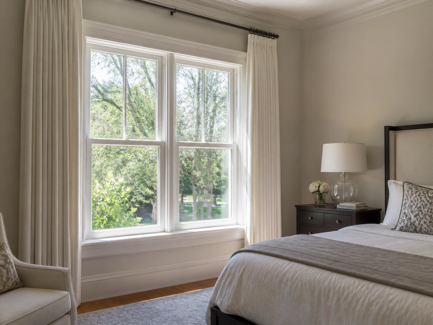 Traditional bedroom with white double hung windows