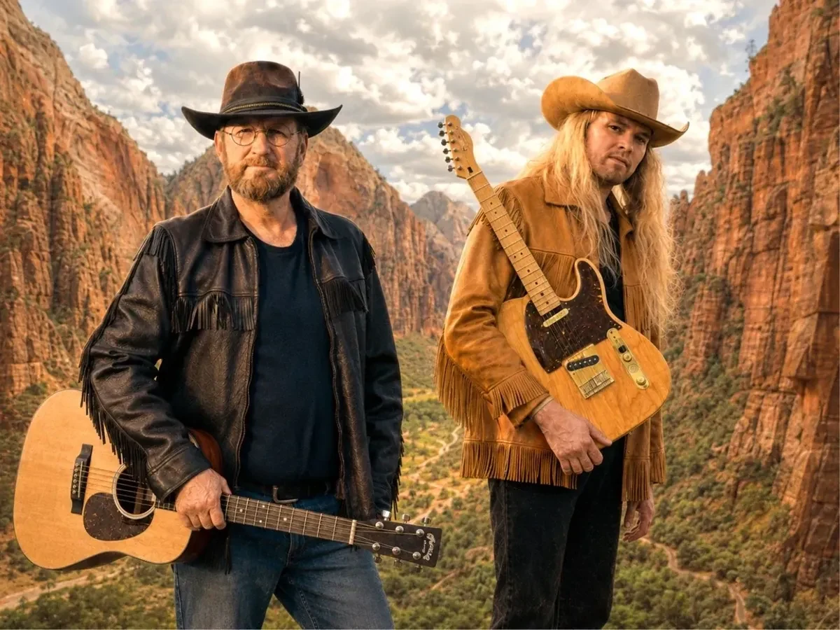 Terry Derosier and Ethan Elseth with their guitars in a Western canyon setting