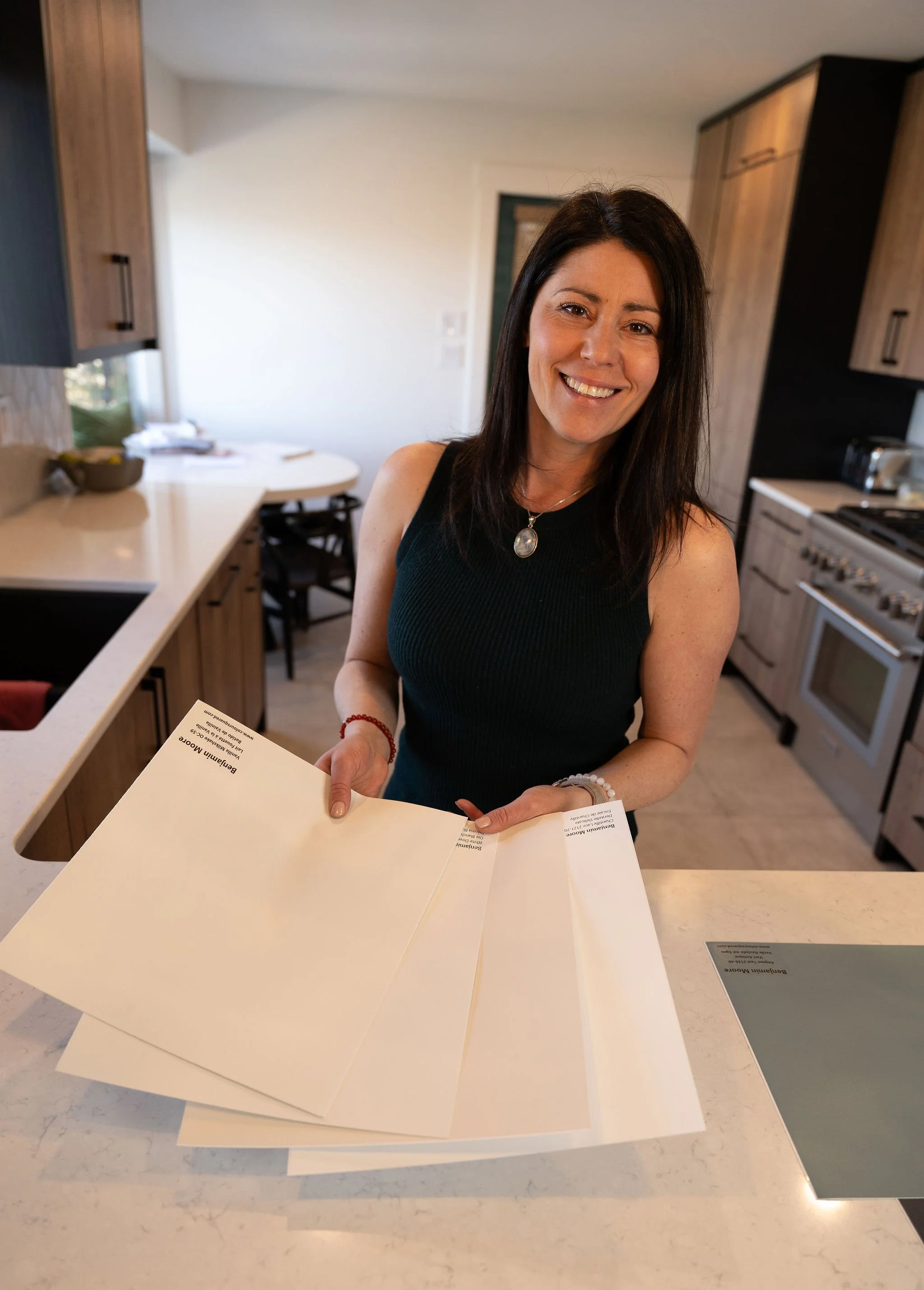 Andrea holding paint swatches