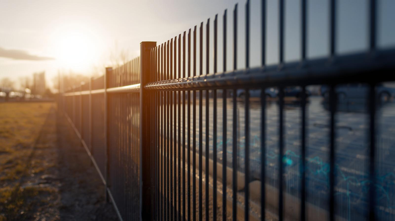 Commercial chain link fence installed around industrial property in Rockford IL.