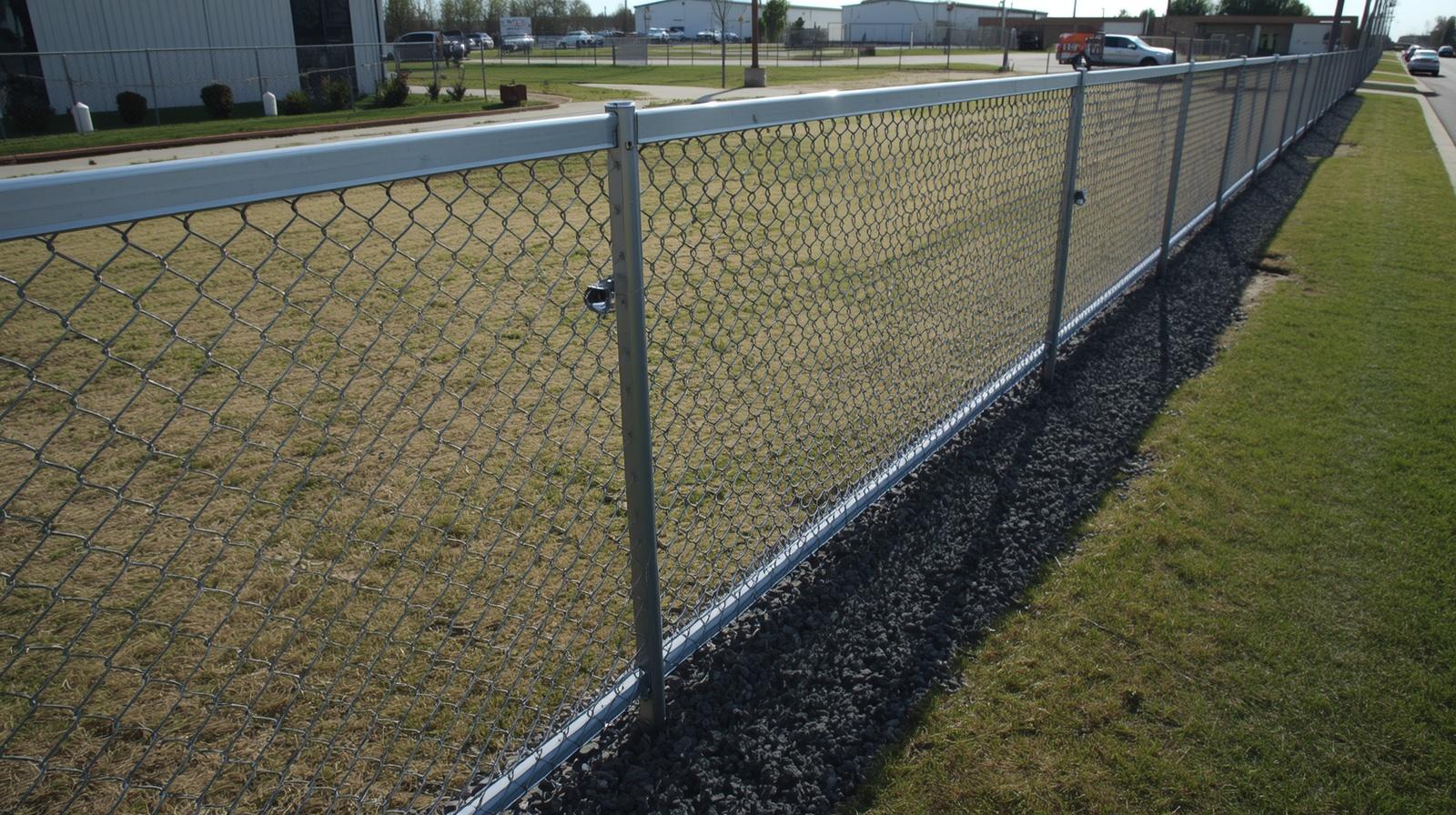 Commercial chain link fence installed around business property in Loves Park IL. Commercial chain link fence installed around business property in Loves Park IL.