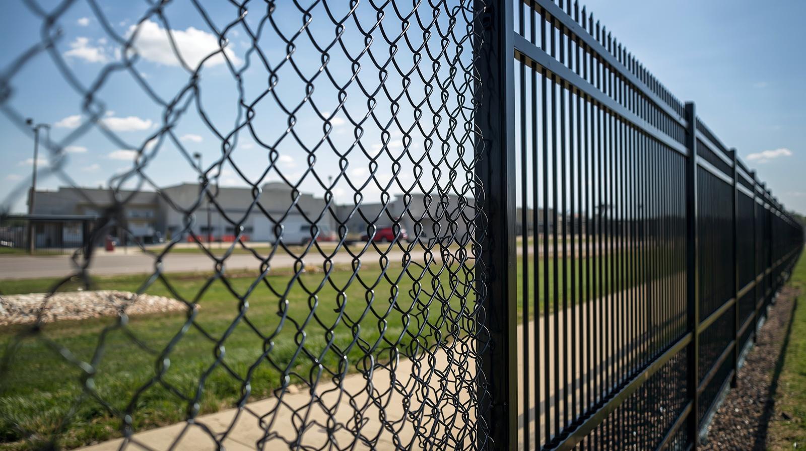 Commercial security fence installed around business property in Delavan WI. Commercial security fence installed around business property in Delavan WI.