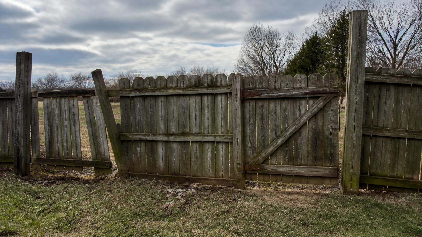 Fence with weather damage, loose posts, and gate issues on a property in Oregon IL. Fence with weather damage, loose posts, and gate issues on a property in Oregon IL.