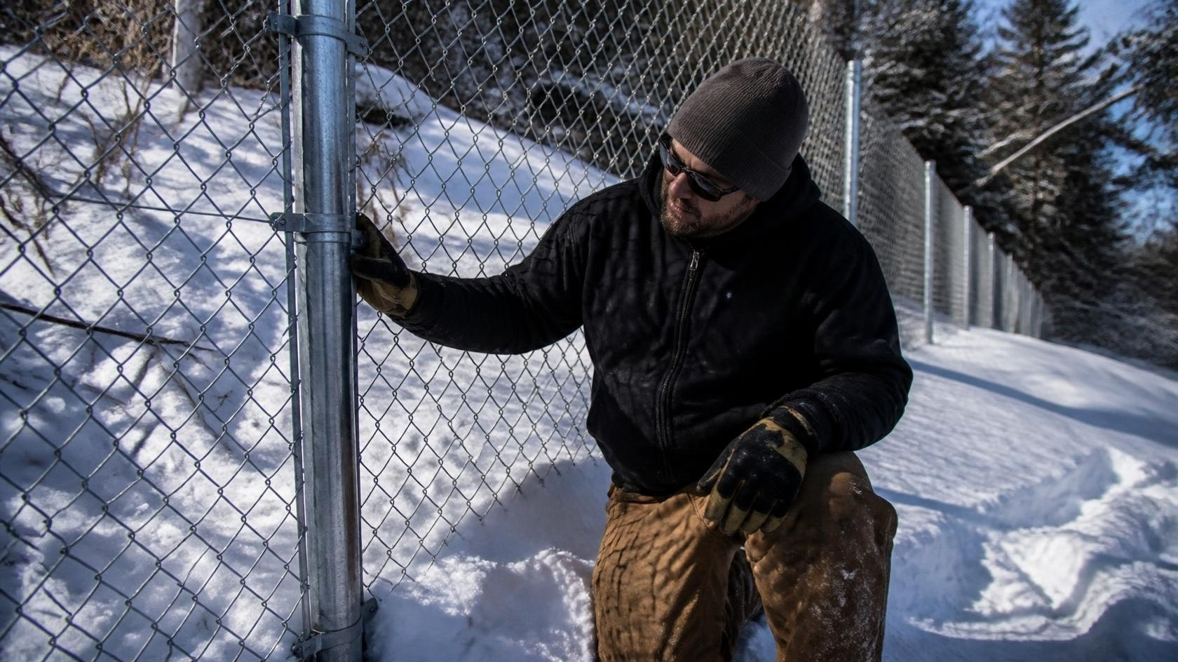 Commercial fence in DeKalb, IL being inspected for damaged posts, shifting sections, gate issues, and other freeze-thaw problems. Commercial fence in DeKalb, IL being inspected for damaged posts, shifting sections, gate issues, and other freeze-thaw problems.