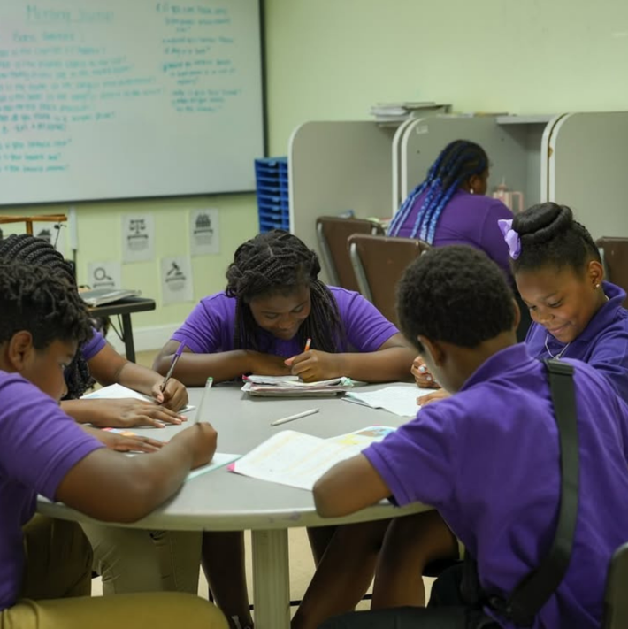 Small class with teacher giving real attention