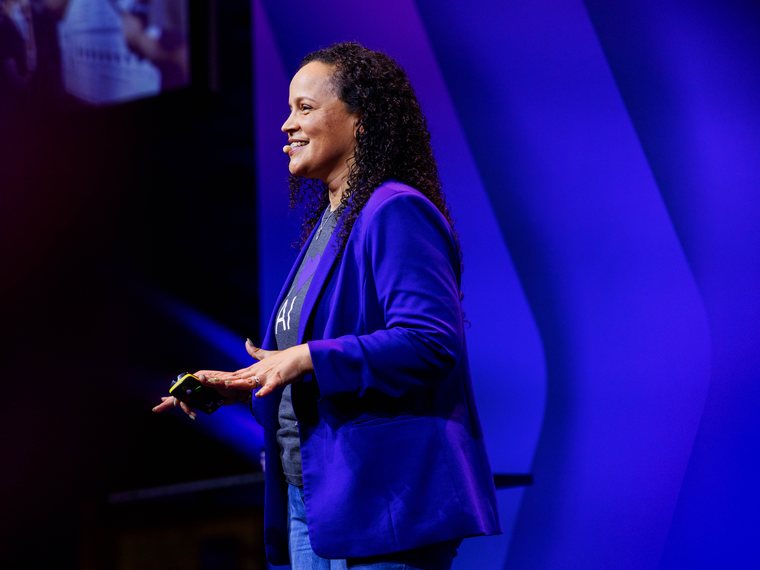 Noelle Russell speaking on stage at Mindvalley University, Amsterdam