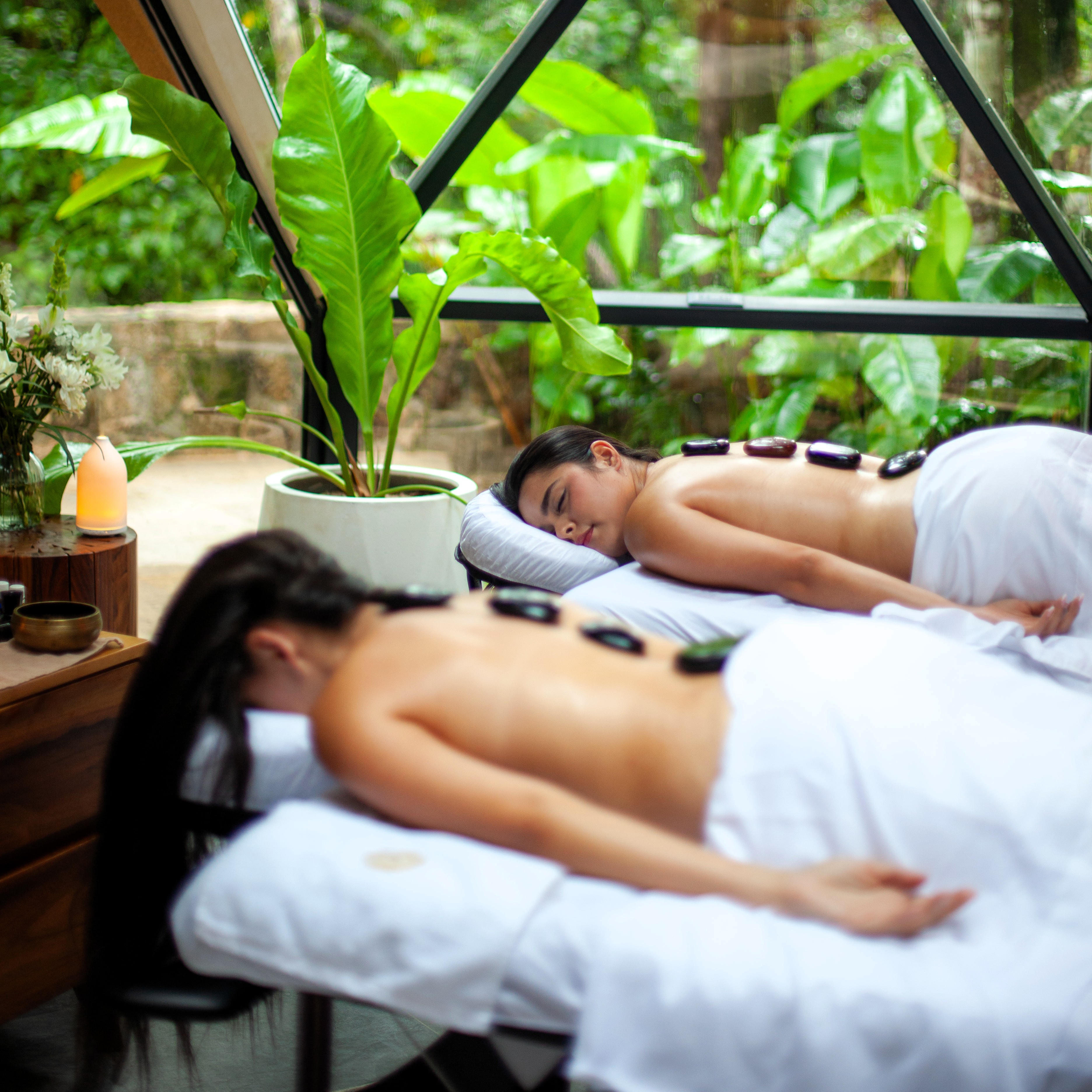 Two guests receiving spa treatments