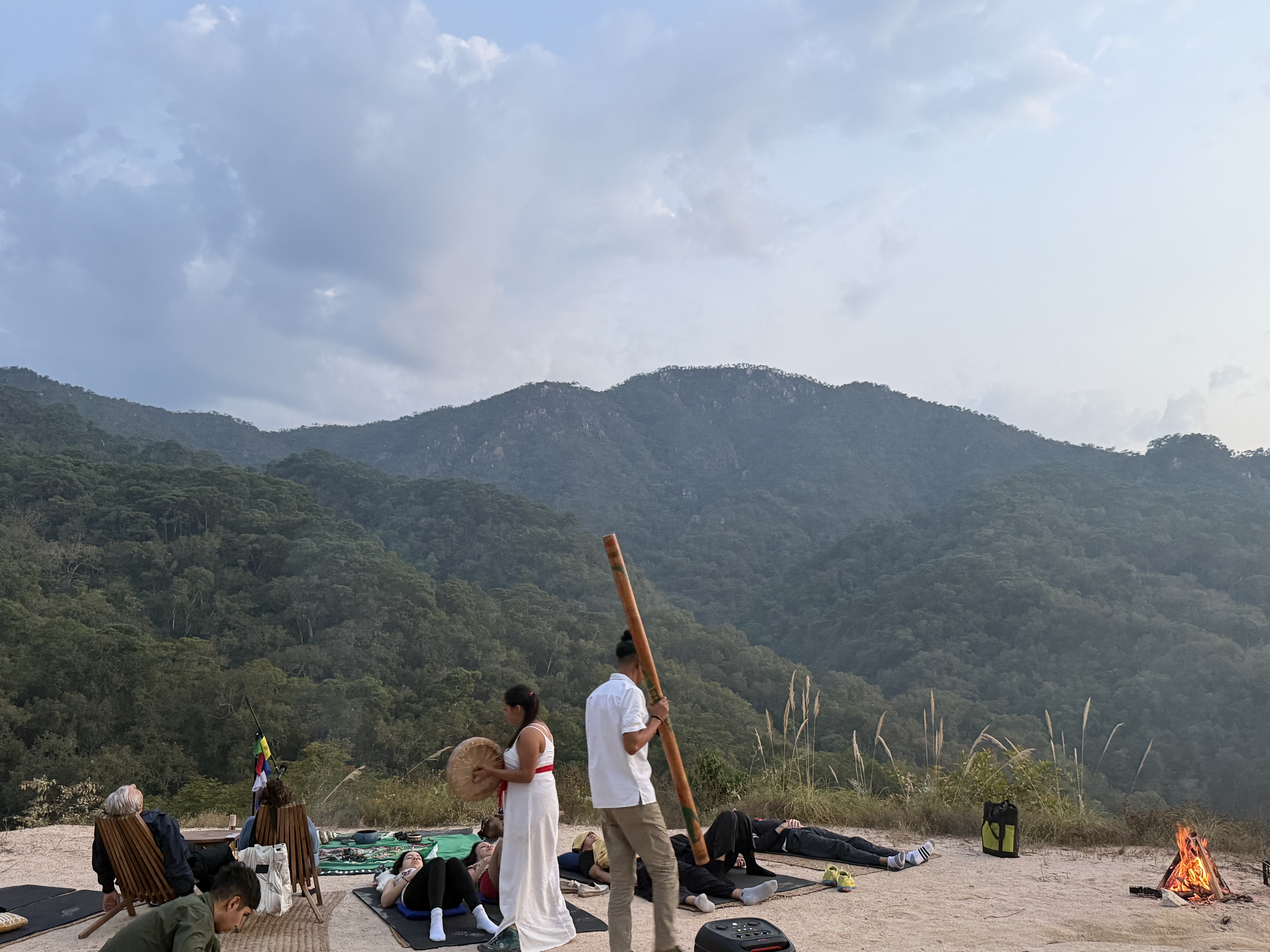 Outdoor sound healing gathering overlooking the mountains