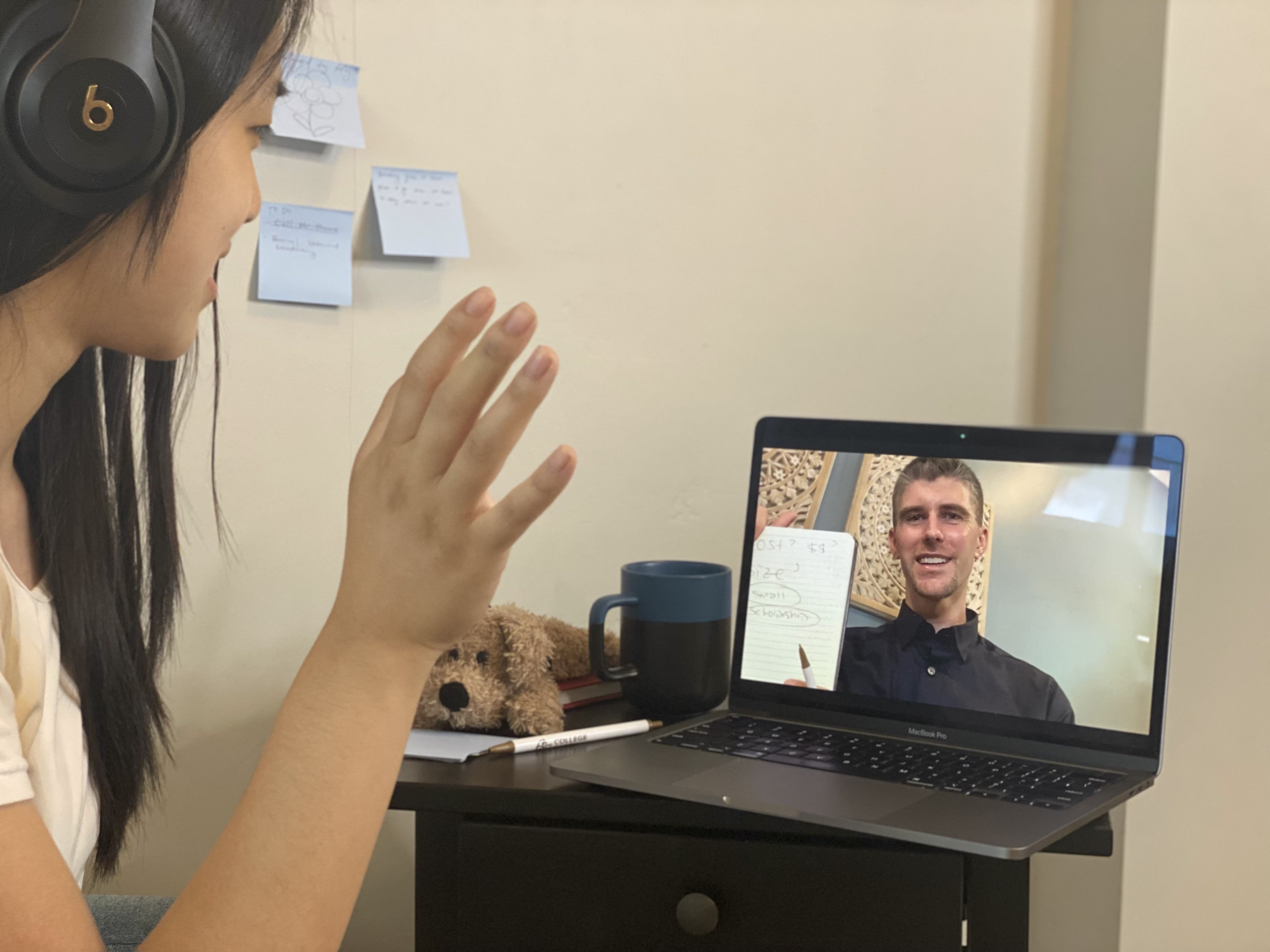 Robert Powers working with a student on their activities list over Zoom