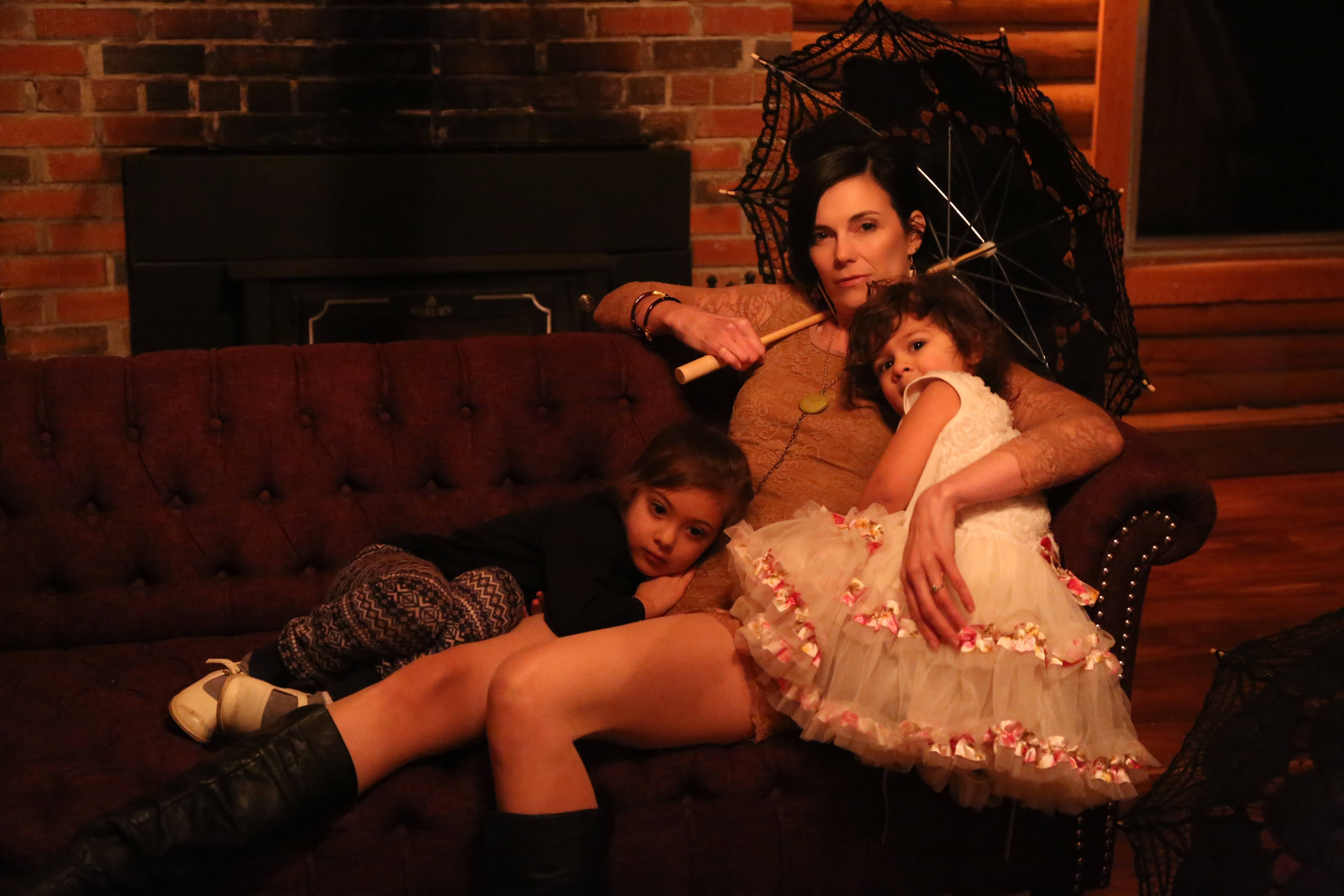 Fireside portrait on the velvet settee