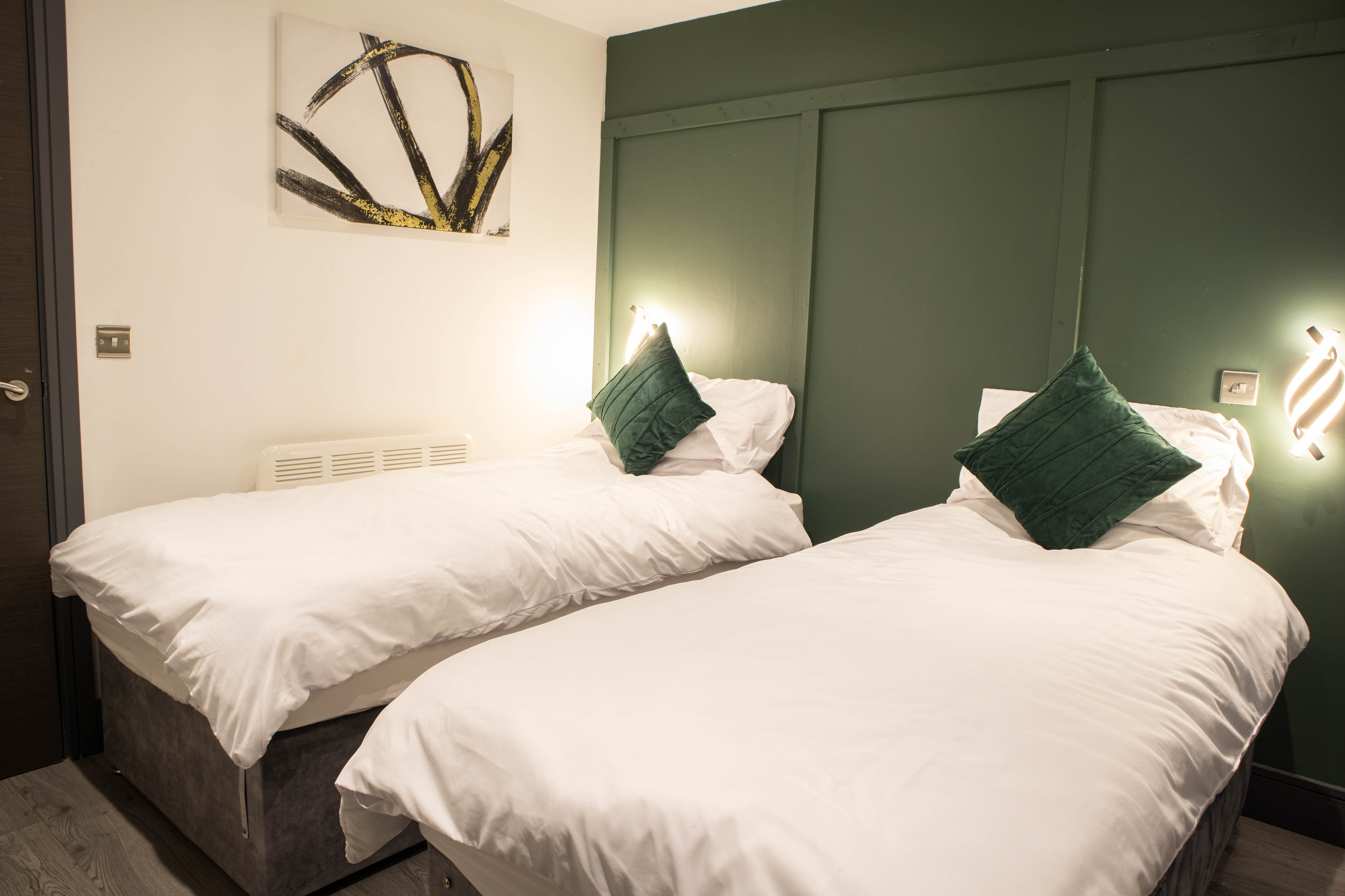 Bedroom with super king zip and link bed in a one-bedroom apartment operated by Apex Stays in Bradford city centre