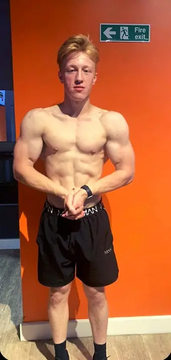 Tristan's after photo - a dramatic change - visibly leaner with defined abs, result of a 12-week body transformation with SYP Fitness personal trainer in Archway