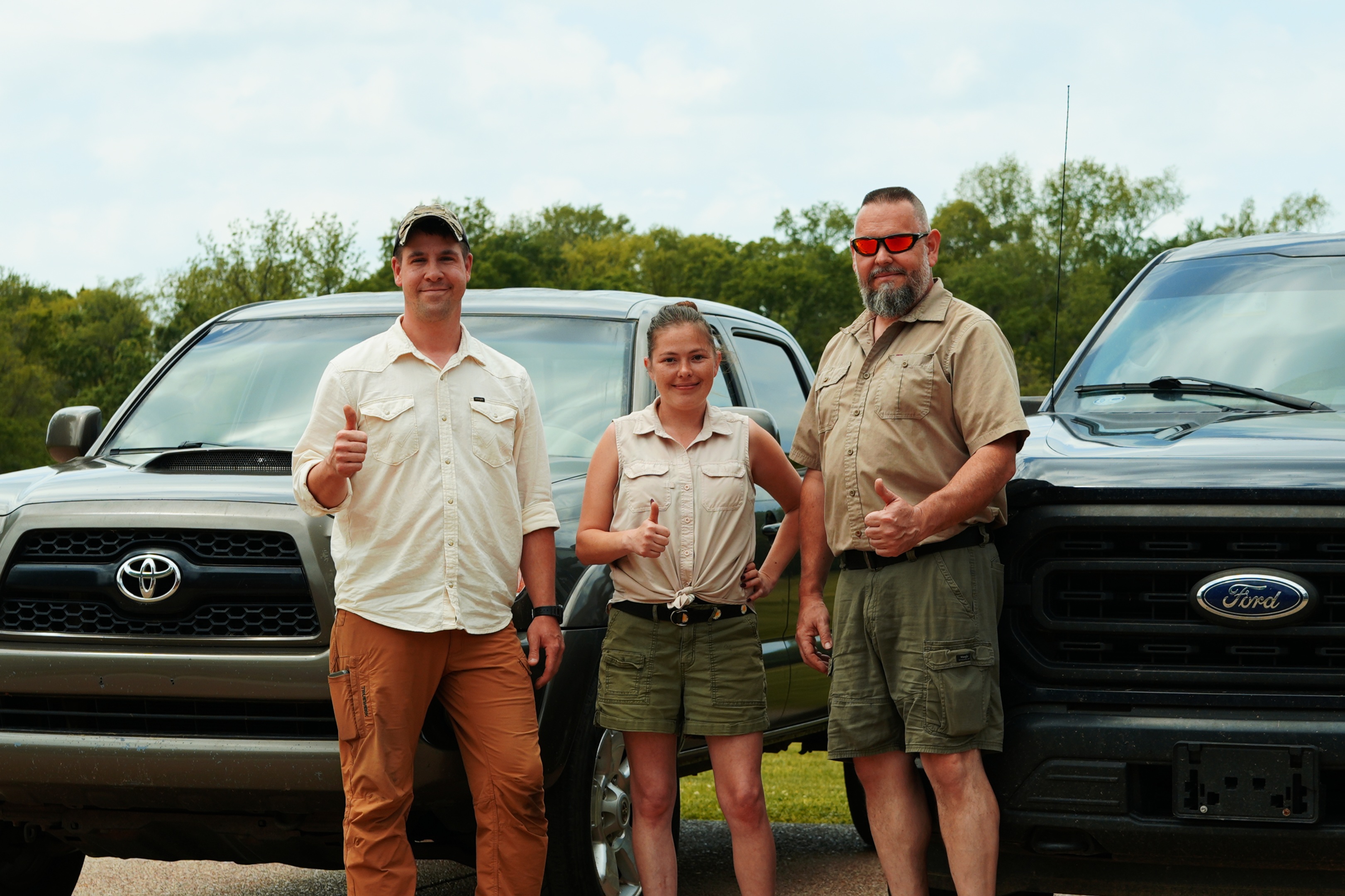 The Ogden Mole Control team standing in front of their trucks