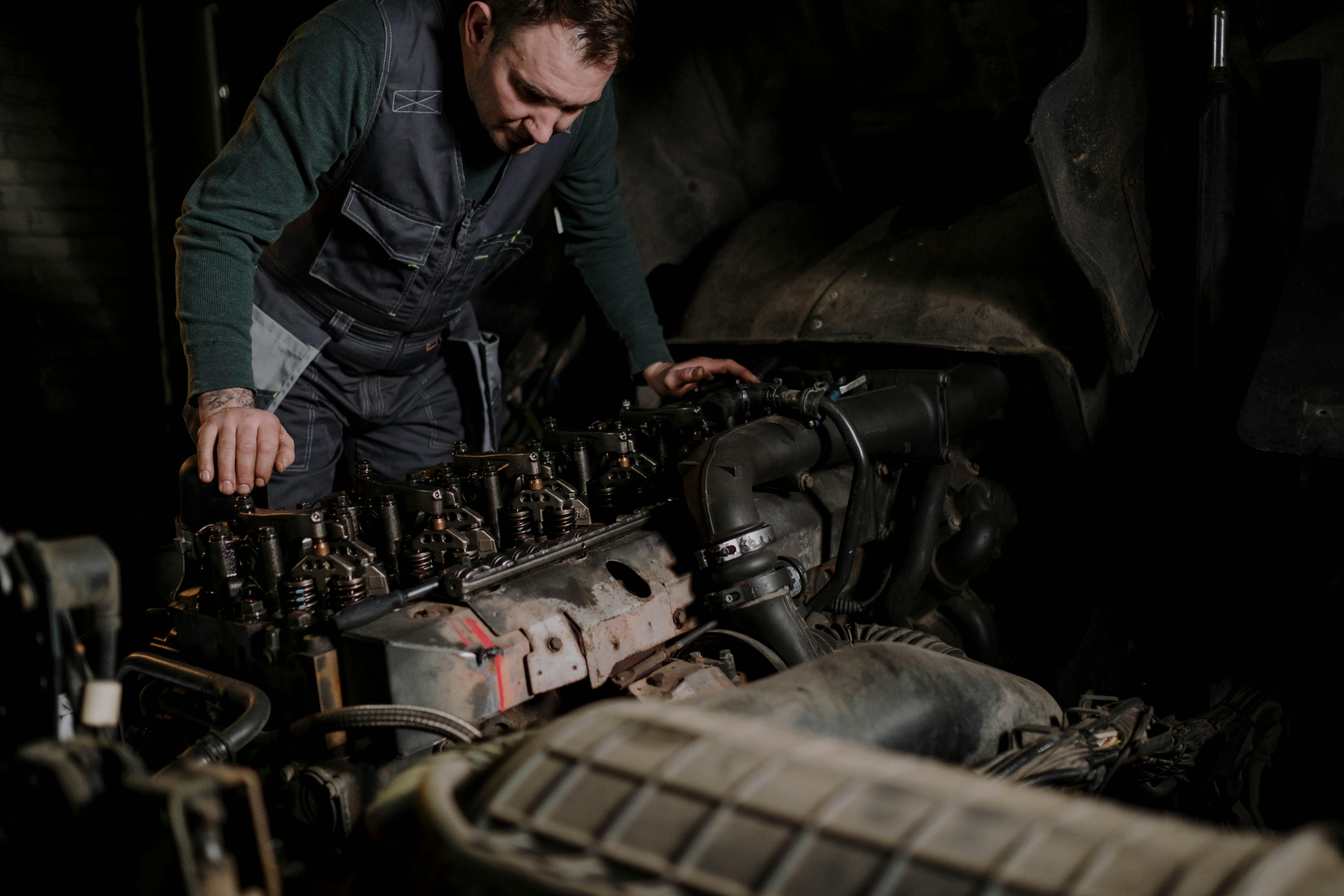 GTS mobile diesel mechanic working on a heavy-duty truck engine during an emergency roadside repair call