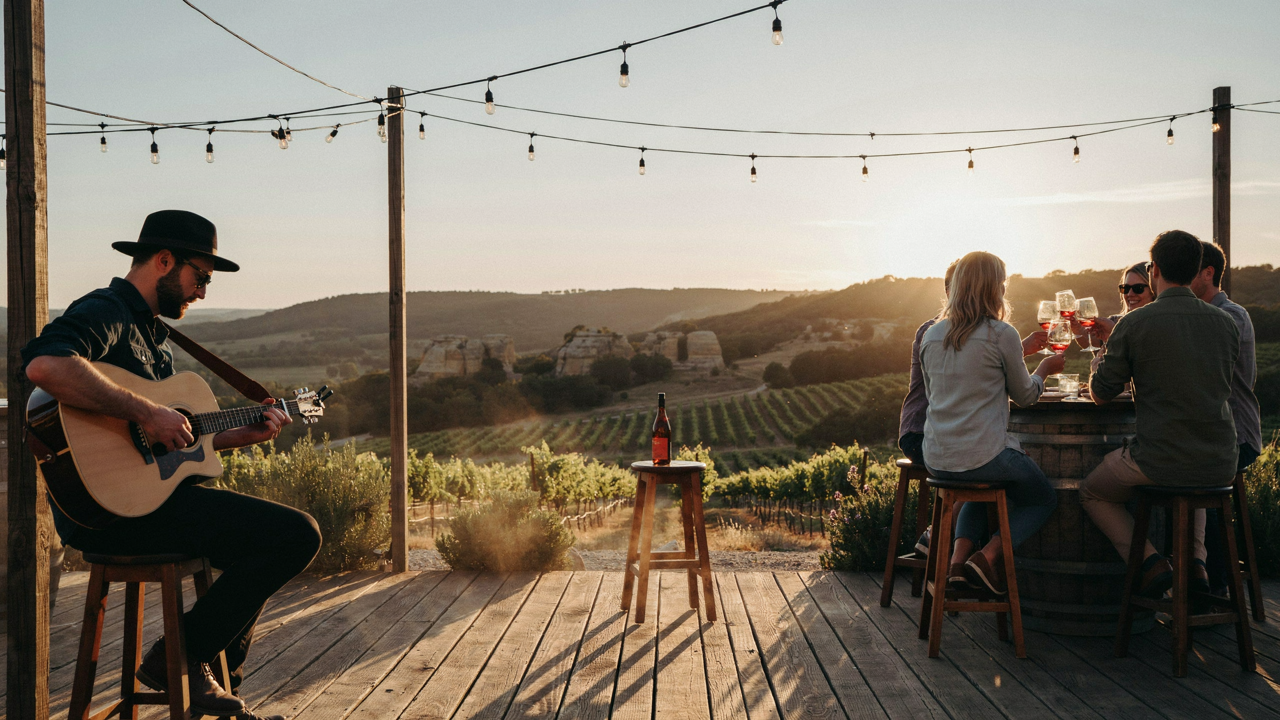 Couple slow-dancing between vineyard rows at golden hour
