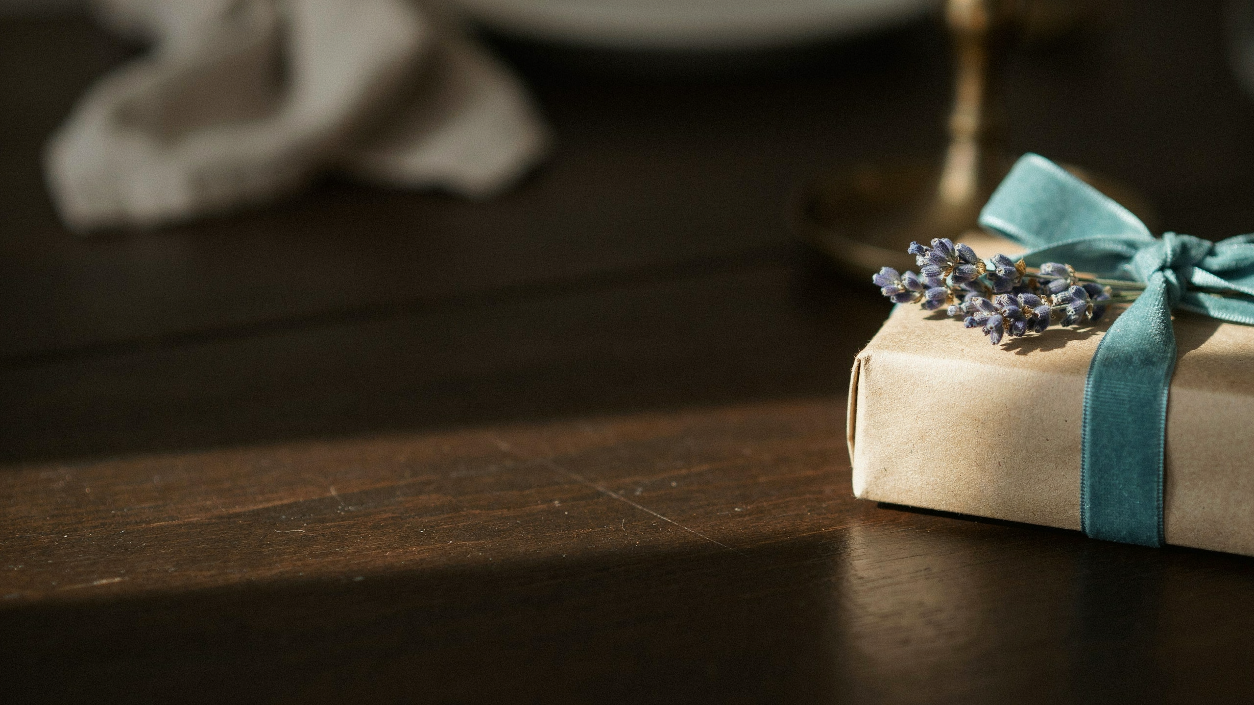 A Turquoise Dor gift wrapped with ribbon and dried botanicals