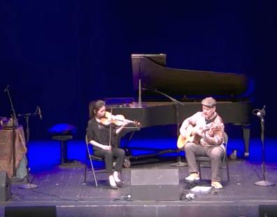 Tim Hillwood in concert at the Eureka Springs City Auditorium with violinist Aviva Tu