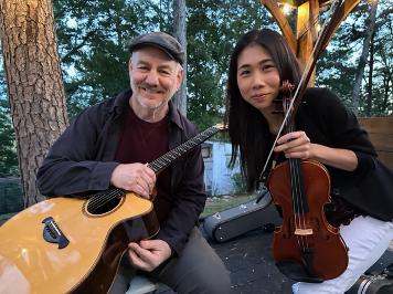 Tim Hillwood and violinist Aviva Tu performing together