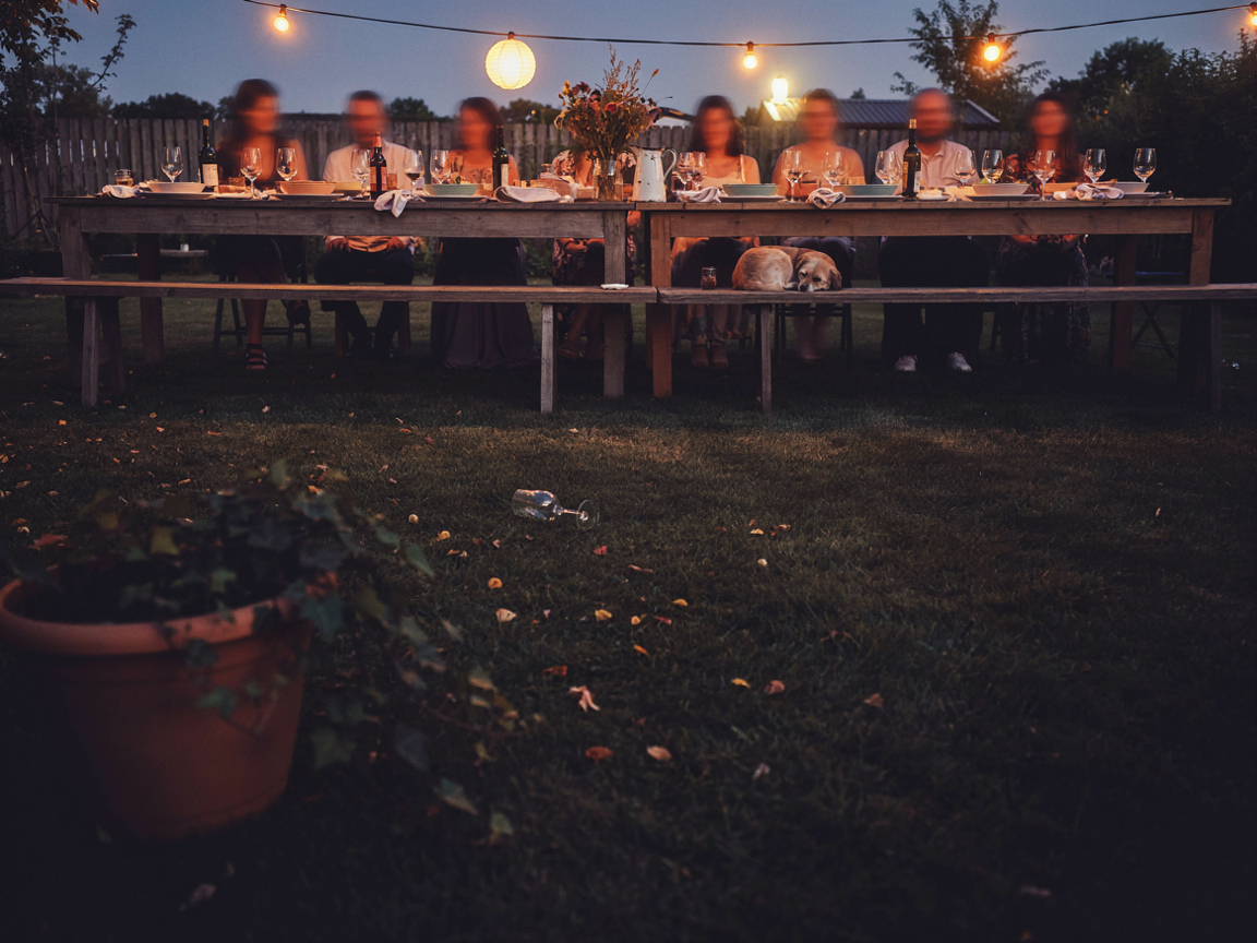 Friends gathered at a warm private dinner table