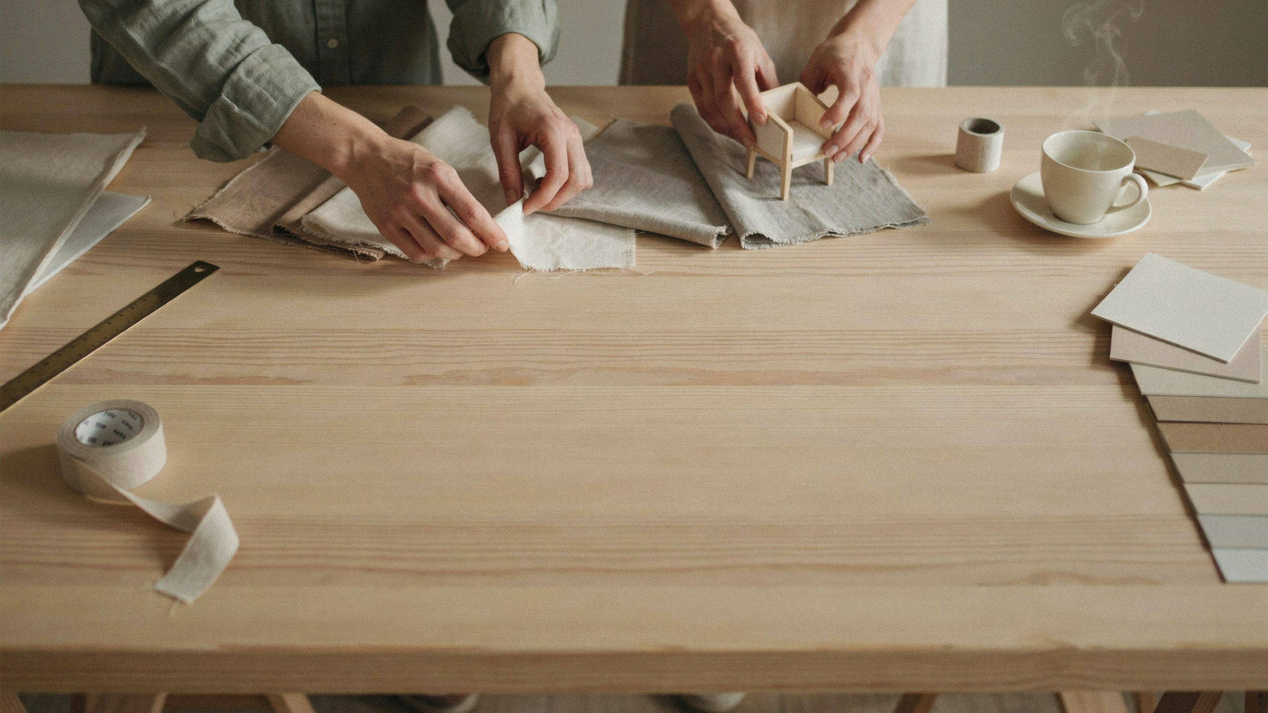 A design student working late at a drafting table