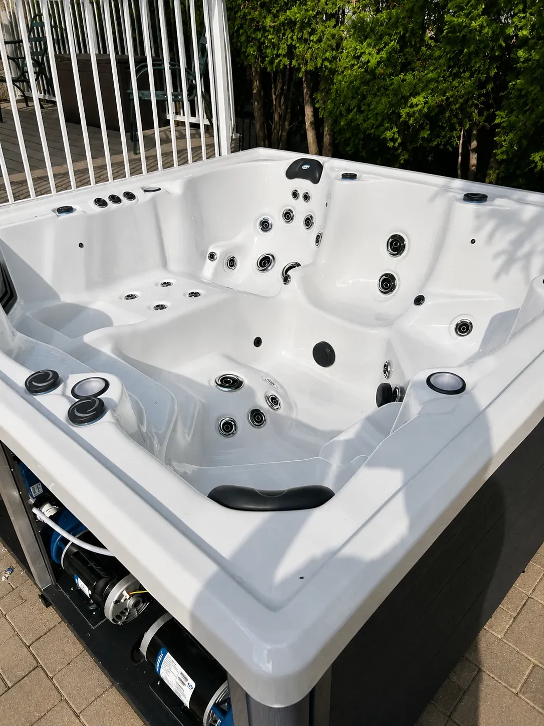 Contoured hot tub seating with hydrotherapy jets throughout the spa