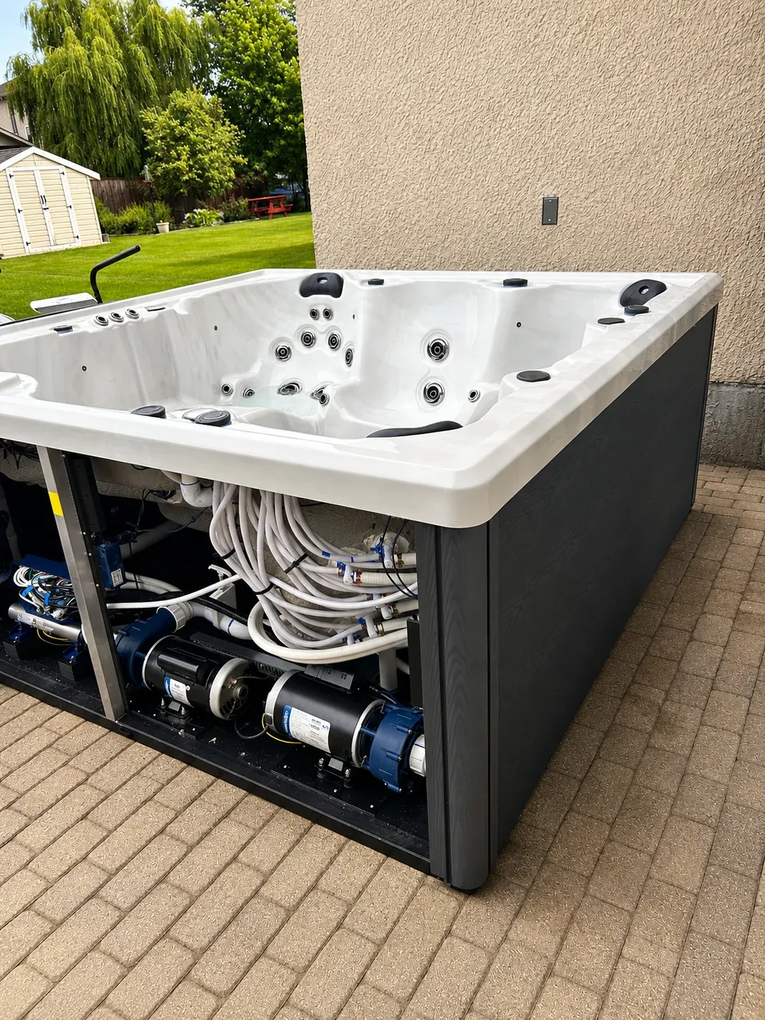 Hot tub pumps, plumbing and internal equipment with the service panel open