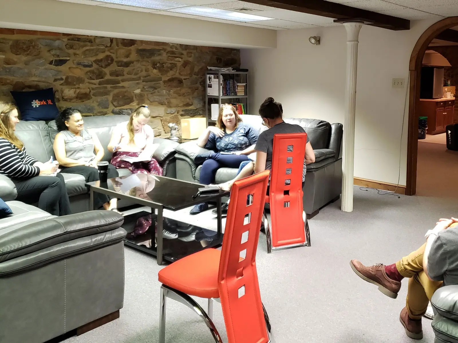 An instructor leading adults through an active EPIC Spanish lesson