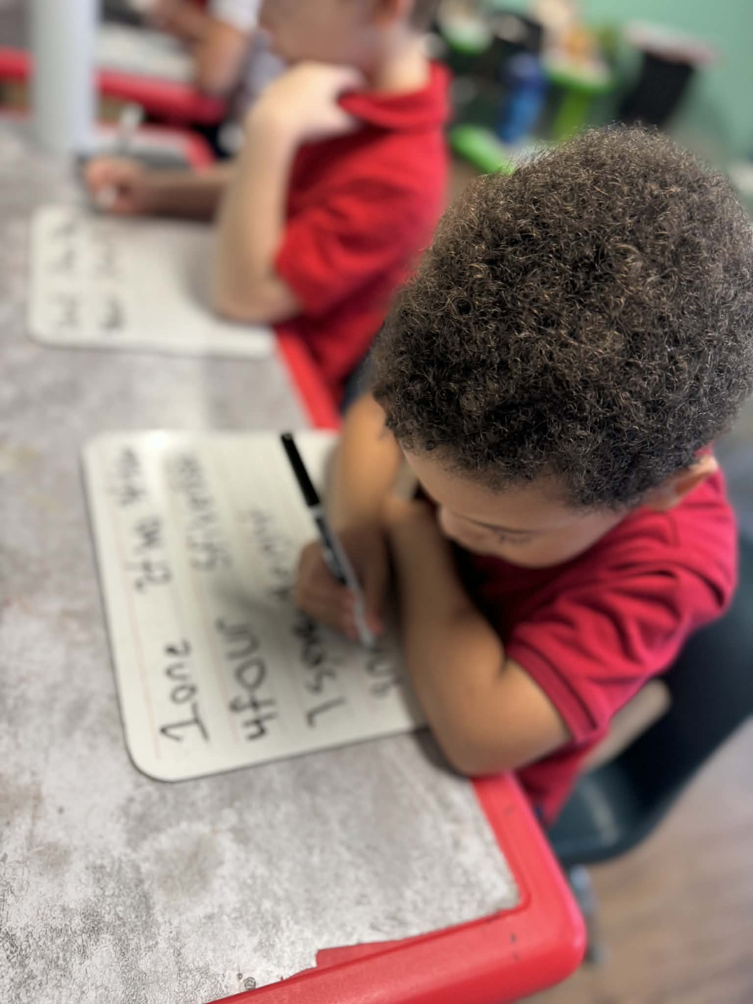 A PCA student working at his desk