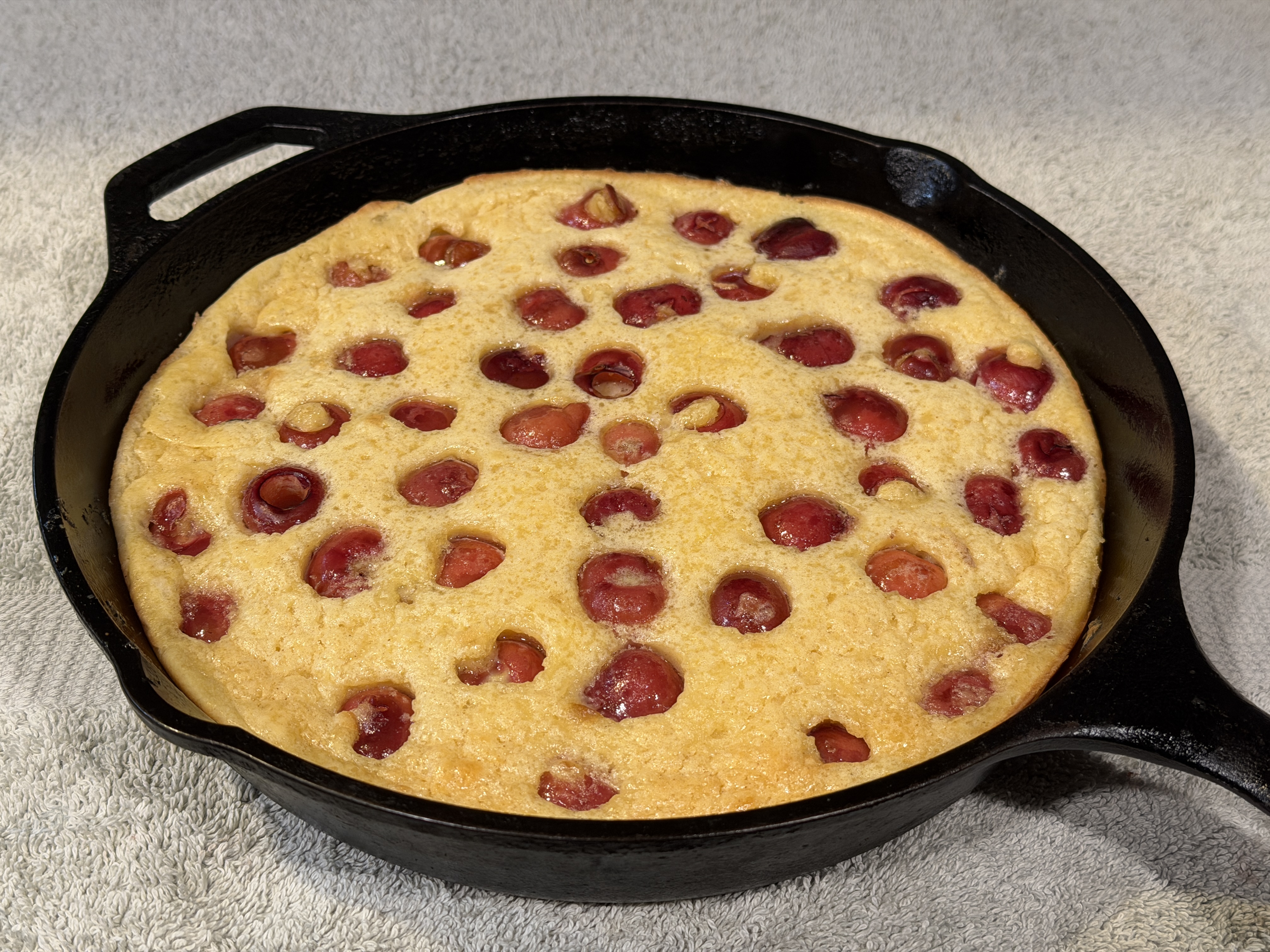 Cherry clafoutis in a cast iron skillet