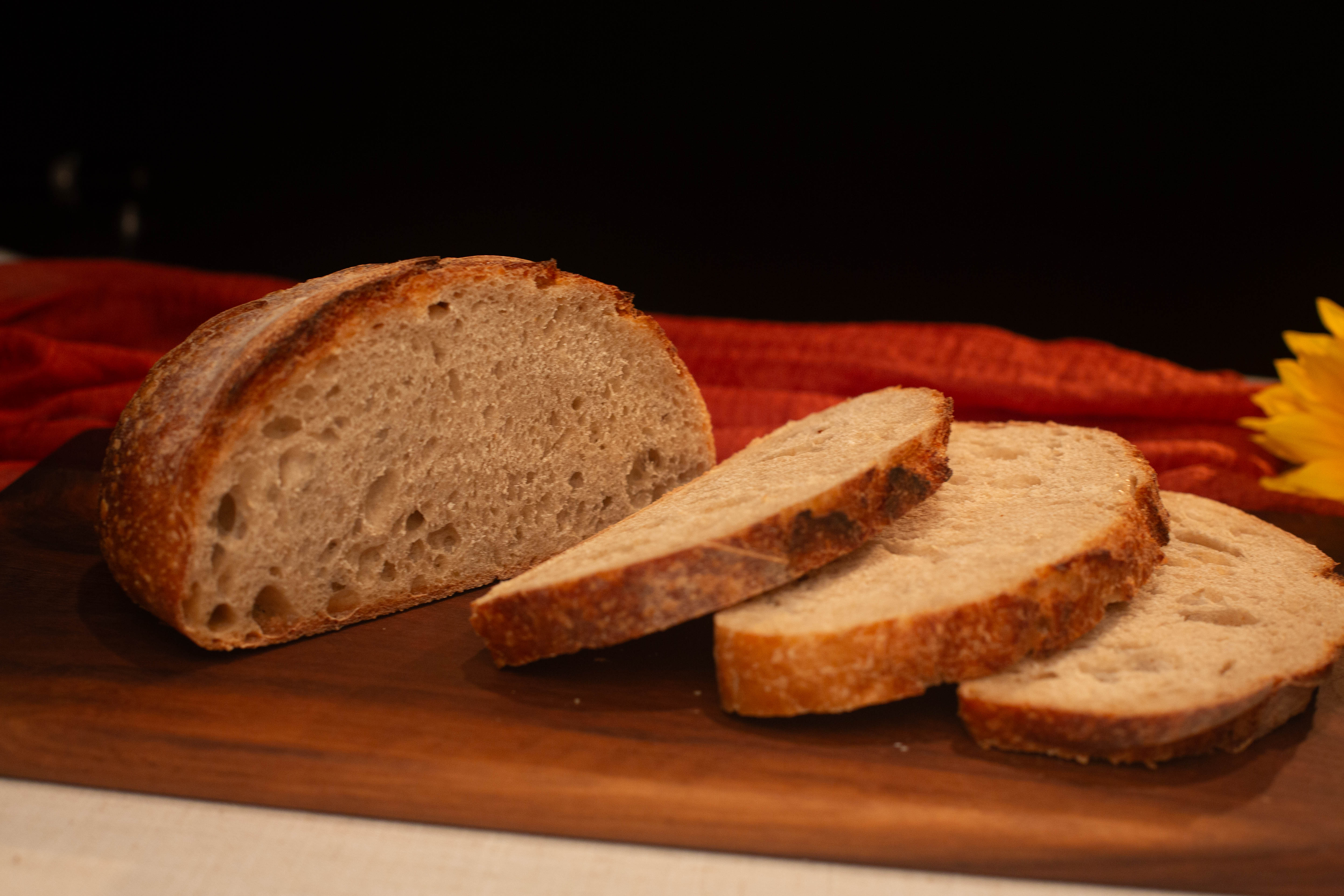 Sliced sourdough loaf showing open crumb