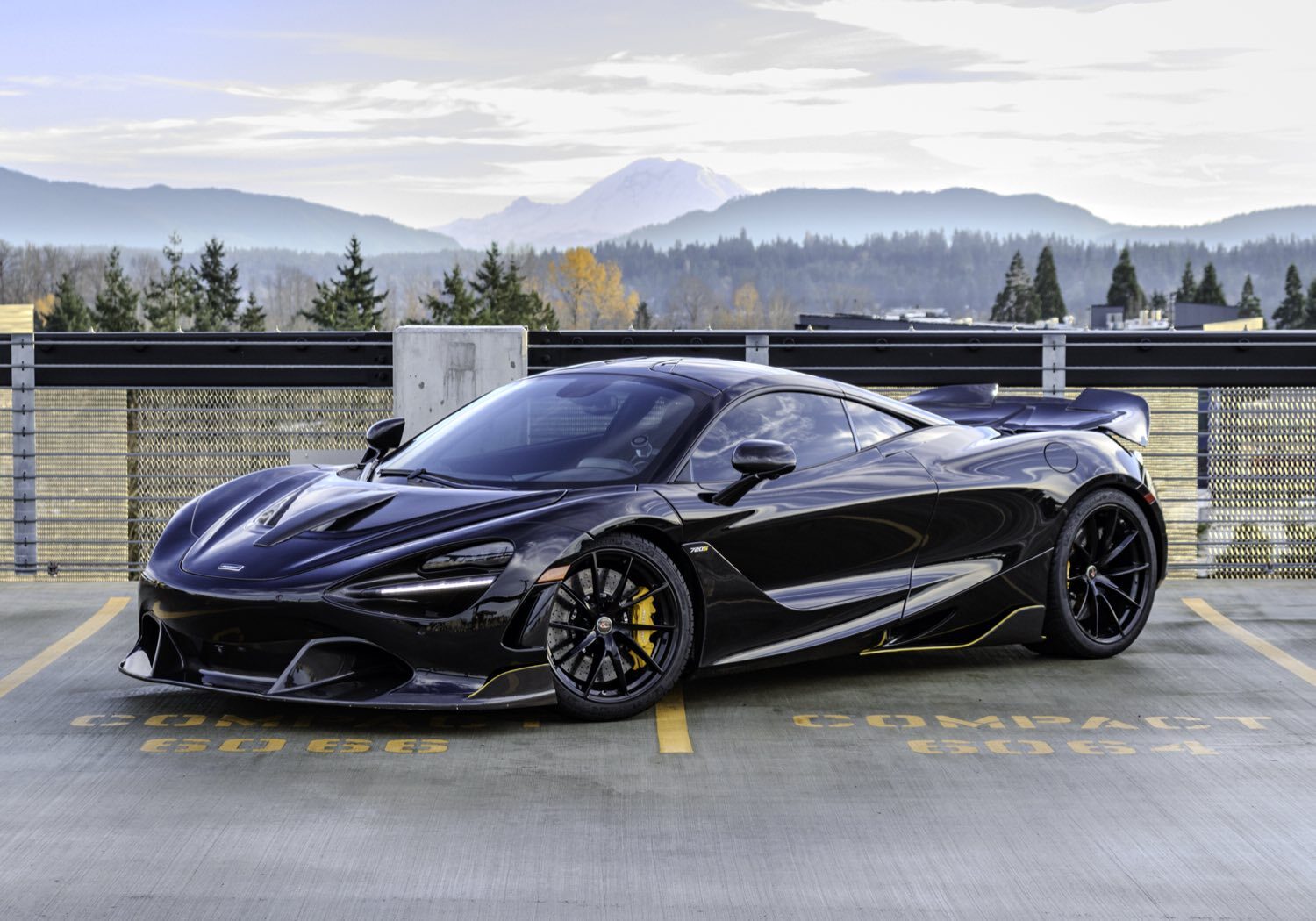 Black McLaren 720S in profile with Mount Rainier behind it, Seattle area