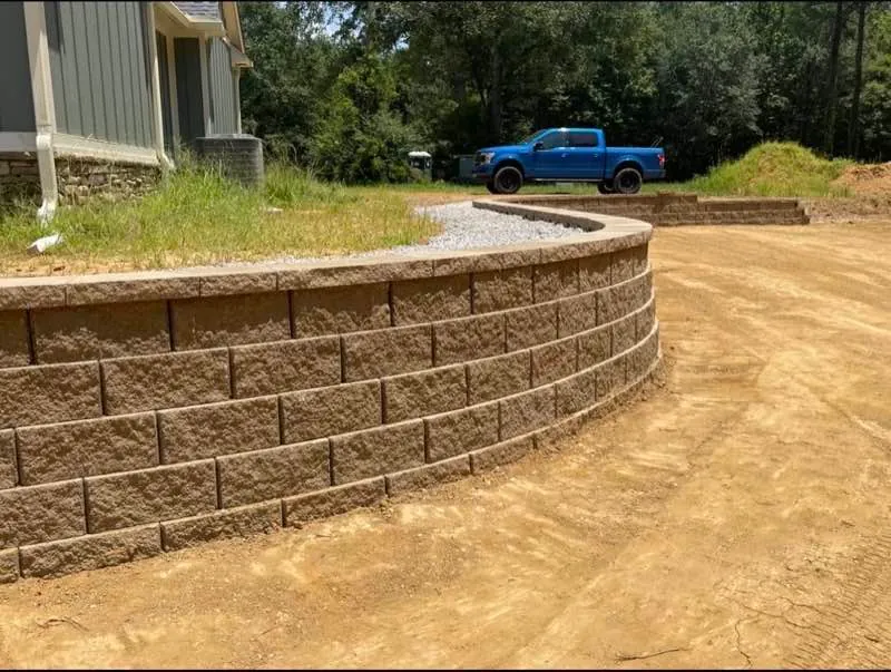 Curved segmental block retaining wall built by Blackburn Construction
