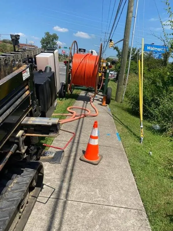 Blackburn Construction crew installing underground utility conduit