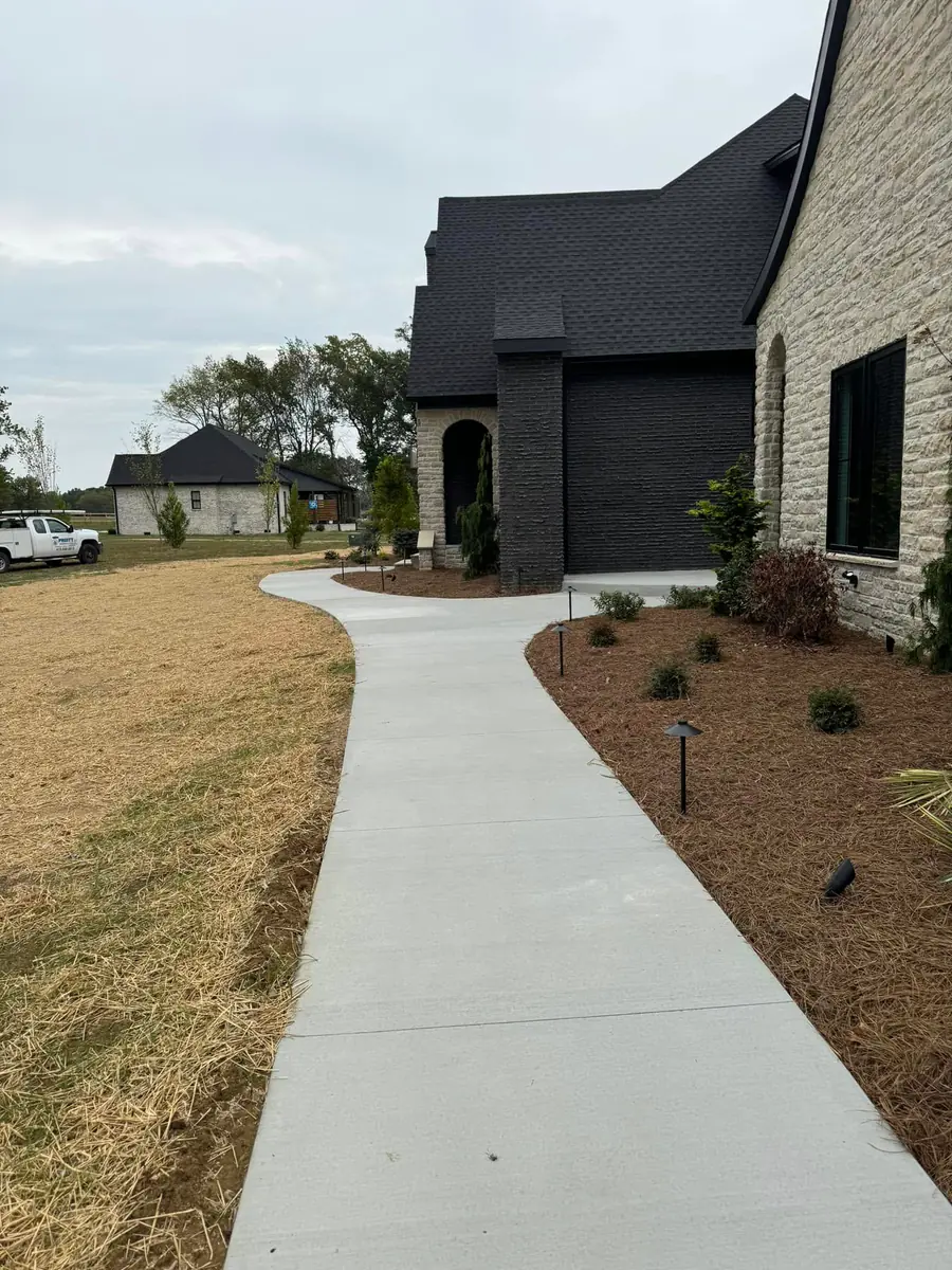 Concrete patio walkway and entry path by Blackburn Construction