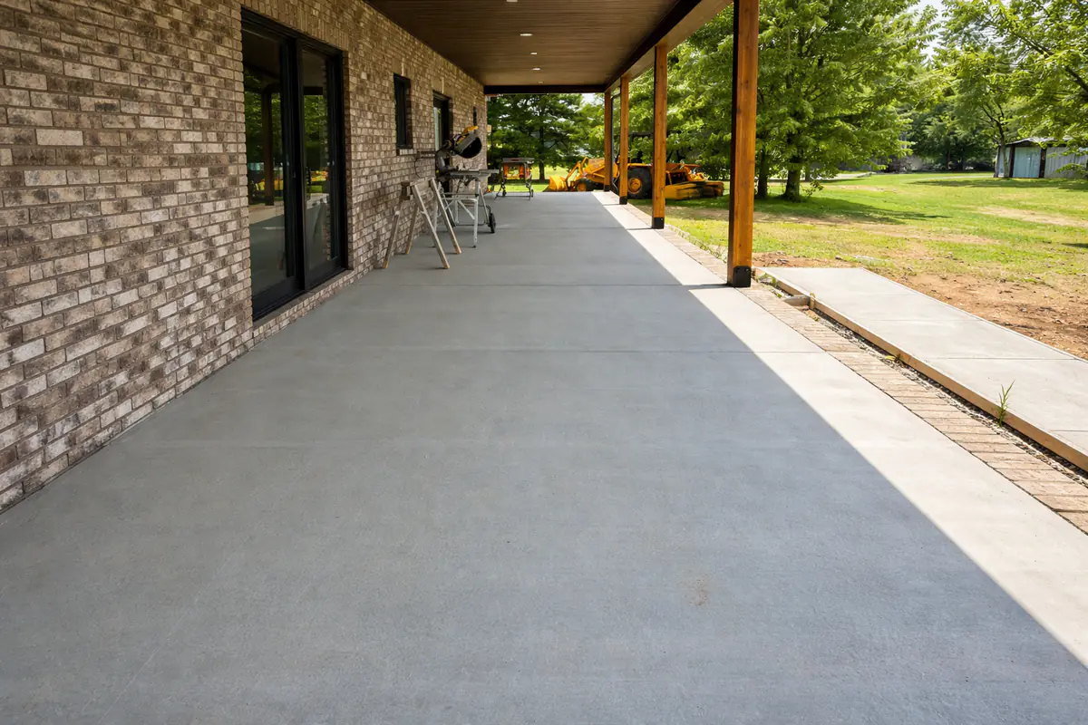 Covered concrete patio and walkway completed by Blackburn Construction