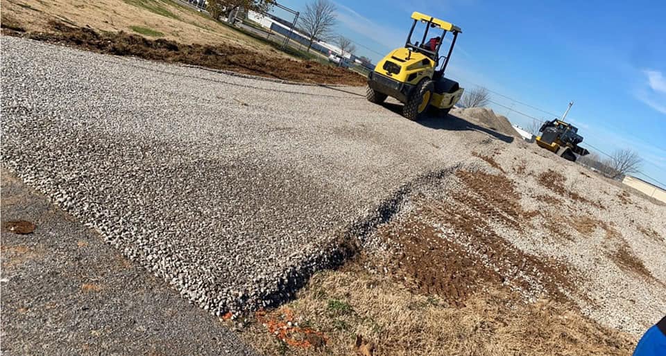 Gravel base being compacted with a roller by Blackburn Construction