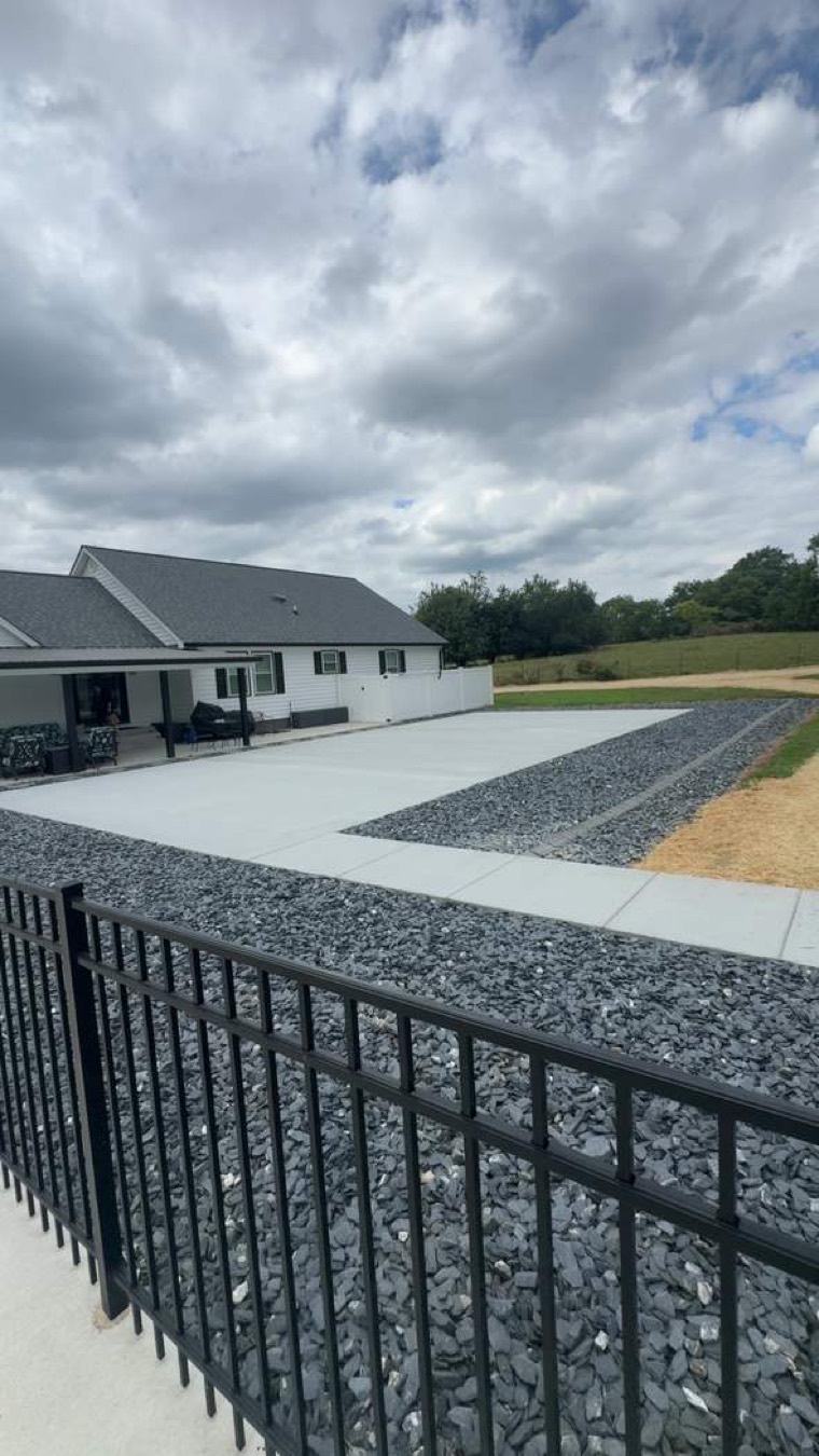 Residential concrete driveway and patio work by Blackburn Construction near White House, TN