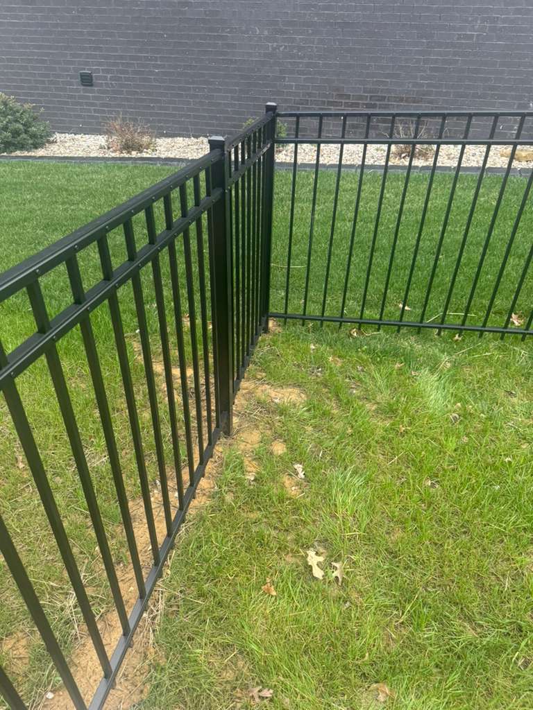 Black aluminum and privacy fencing installation