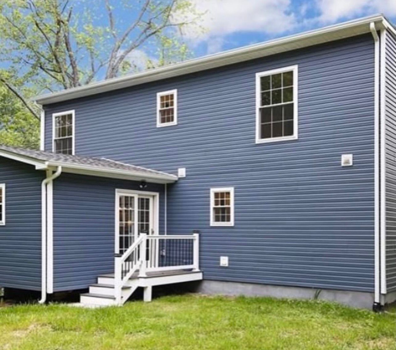 Completed second story home addition in Rye New York showing expanded living space and fully finished upper level integrated into original house design