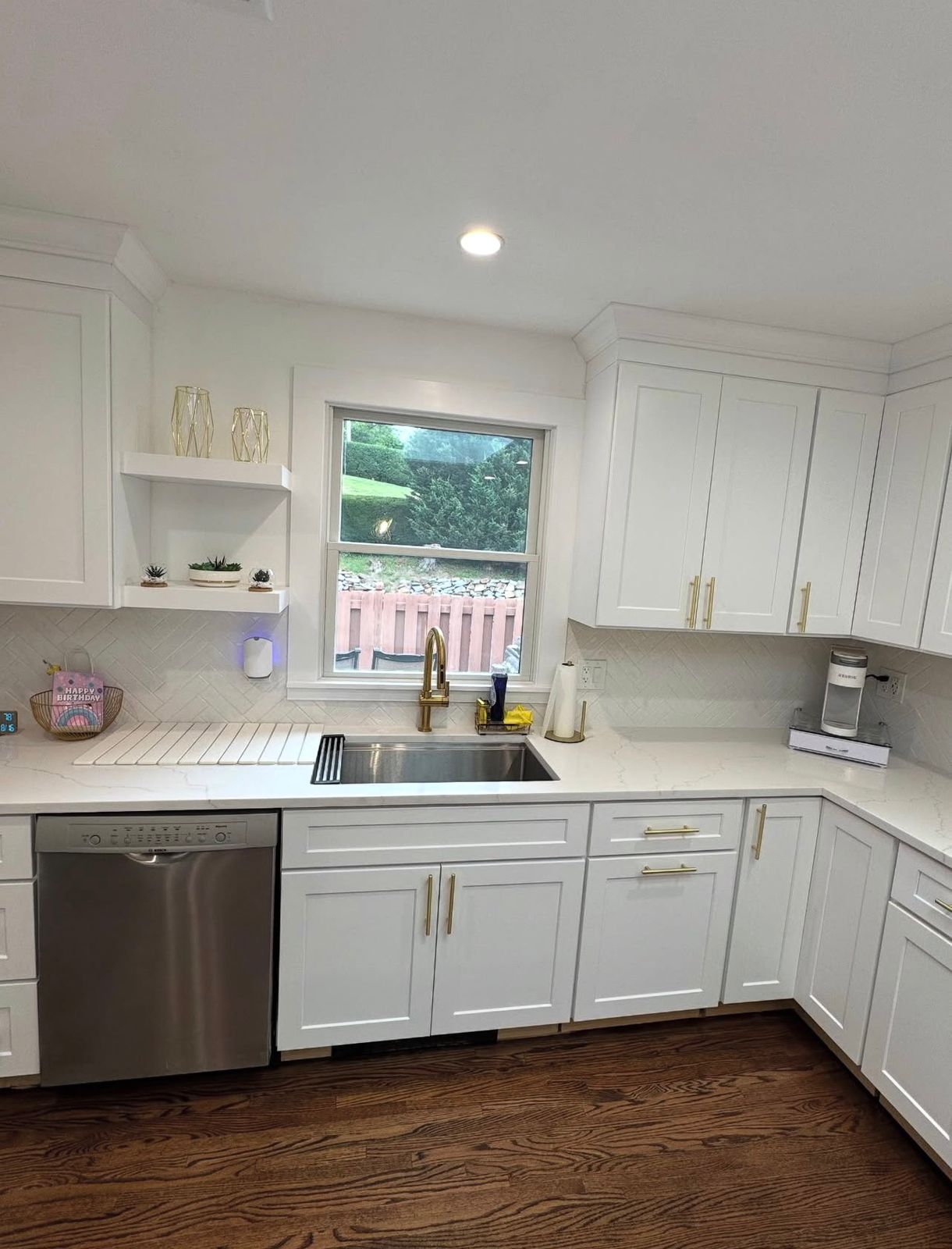 Oak flooring in a modern kitchen remodel in Purchase, NY with open layout